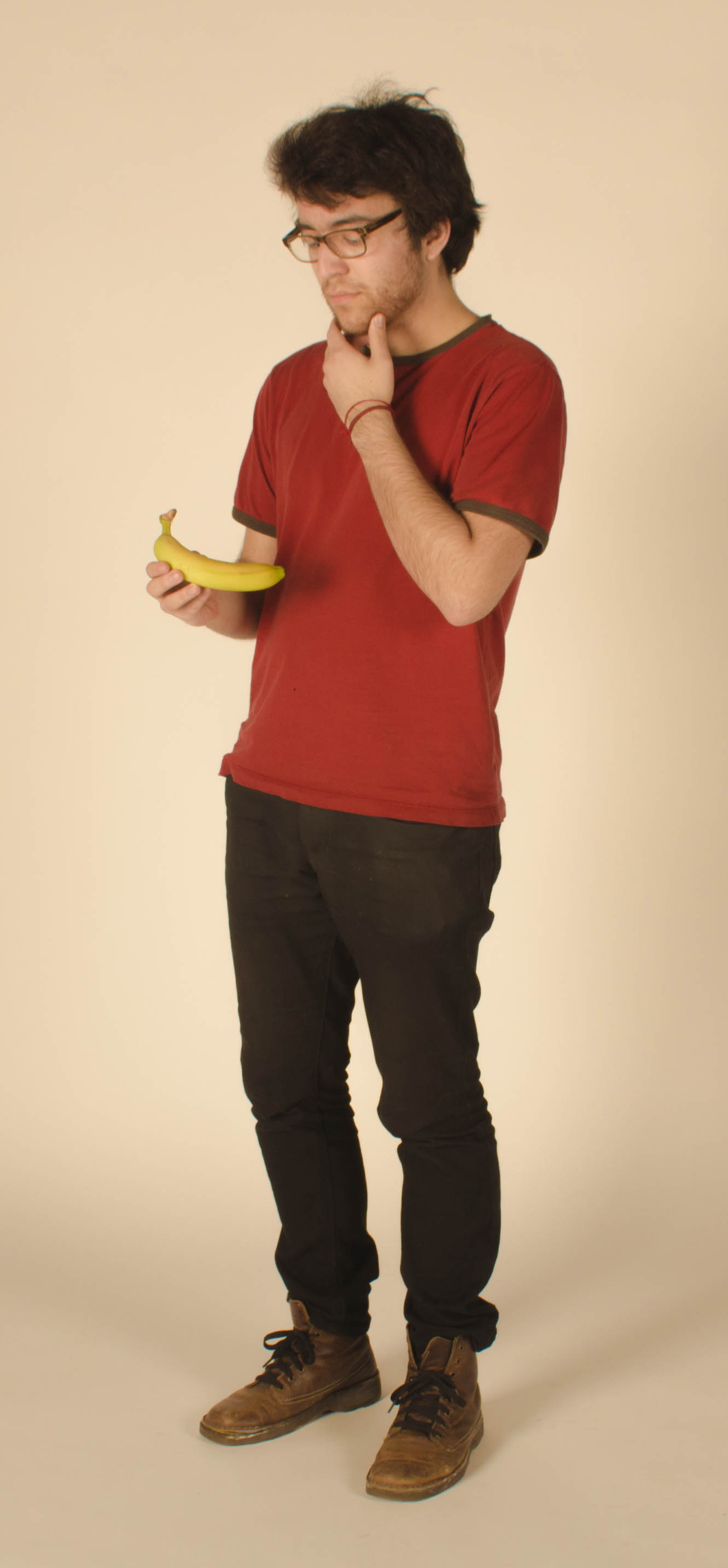 File:Young man observing a banana.jpg - Wikimedia Commons
