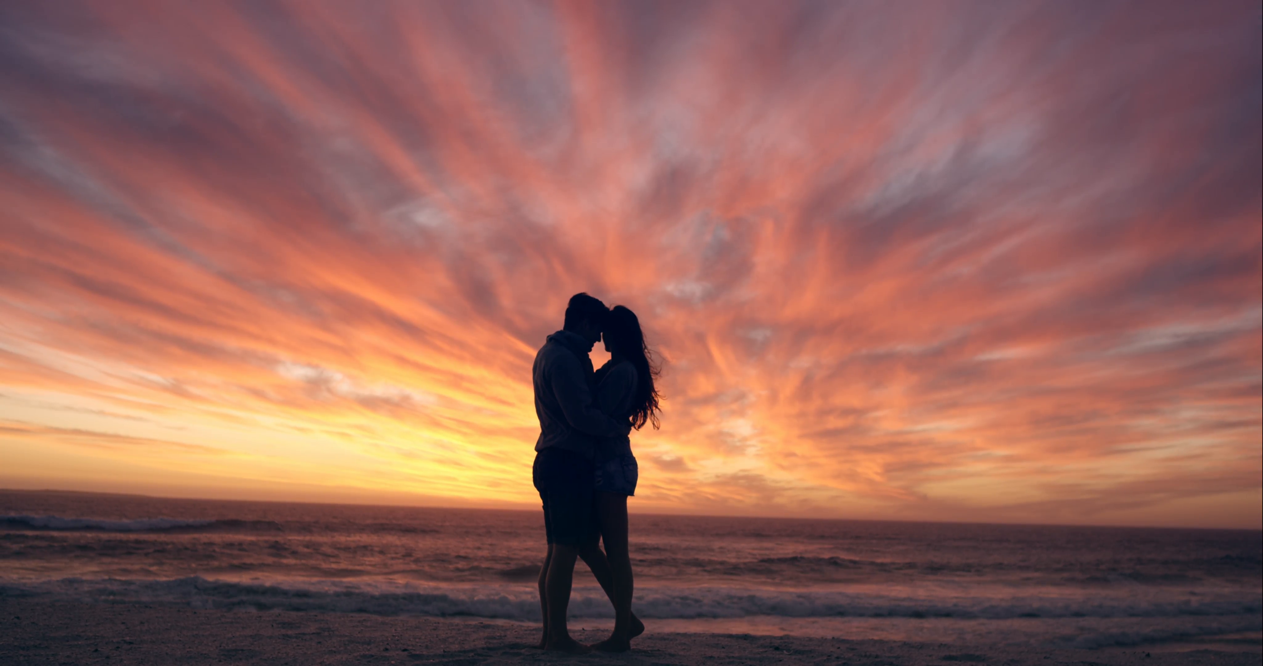 Happy couple kissing on beach at sunset silhouette in love dating on ...