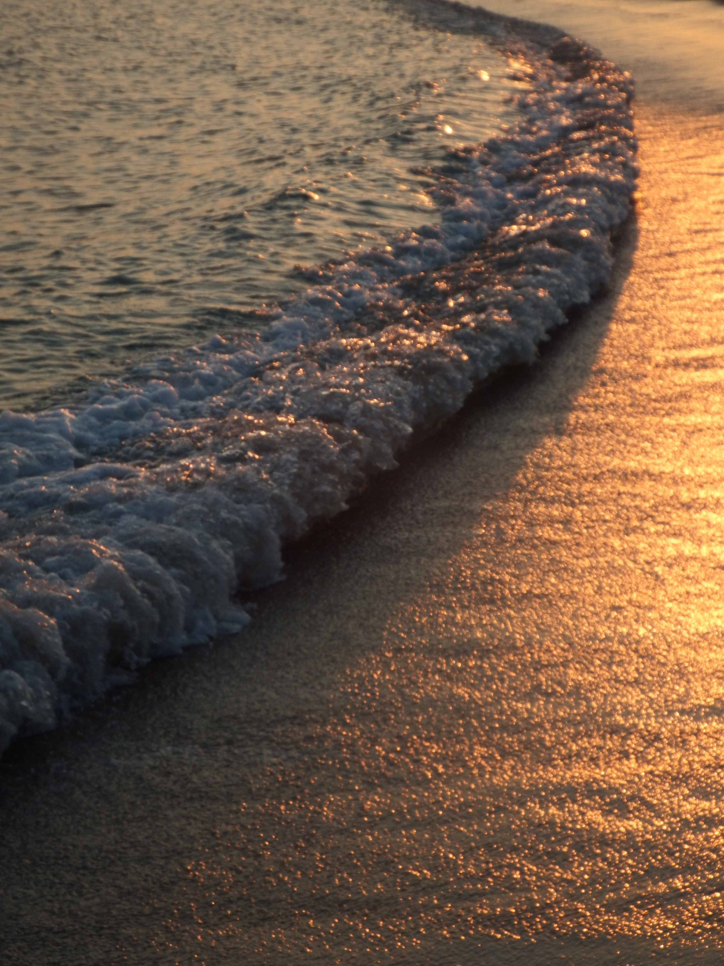 Ocean waves at sunset photo