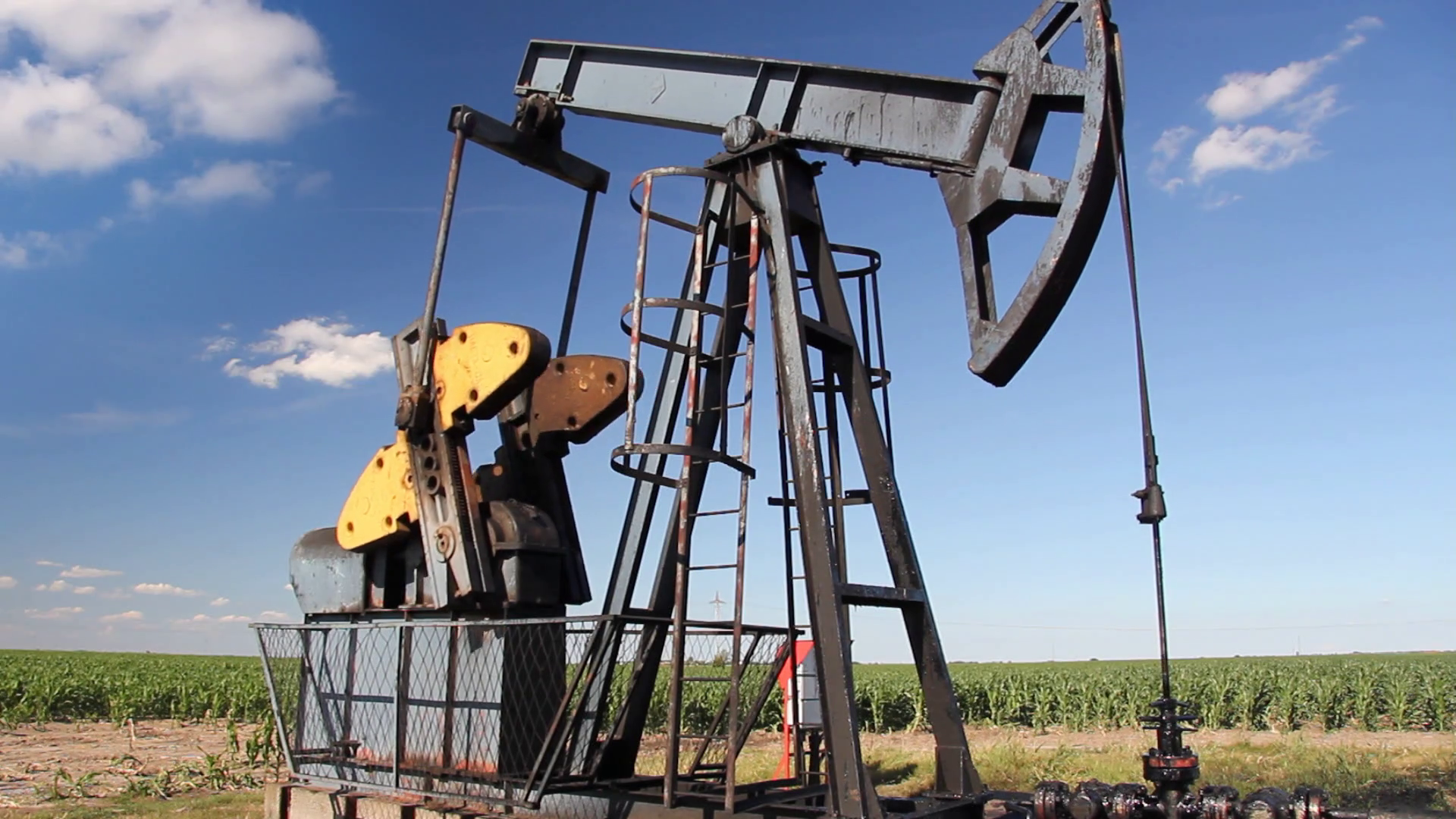 Oil Pump Jack in a Field Stock Video Footage - Videoblocks
