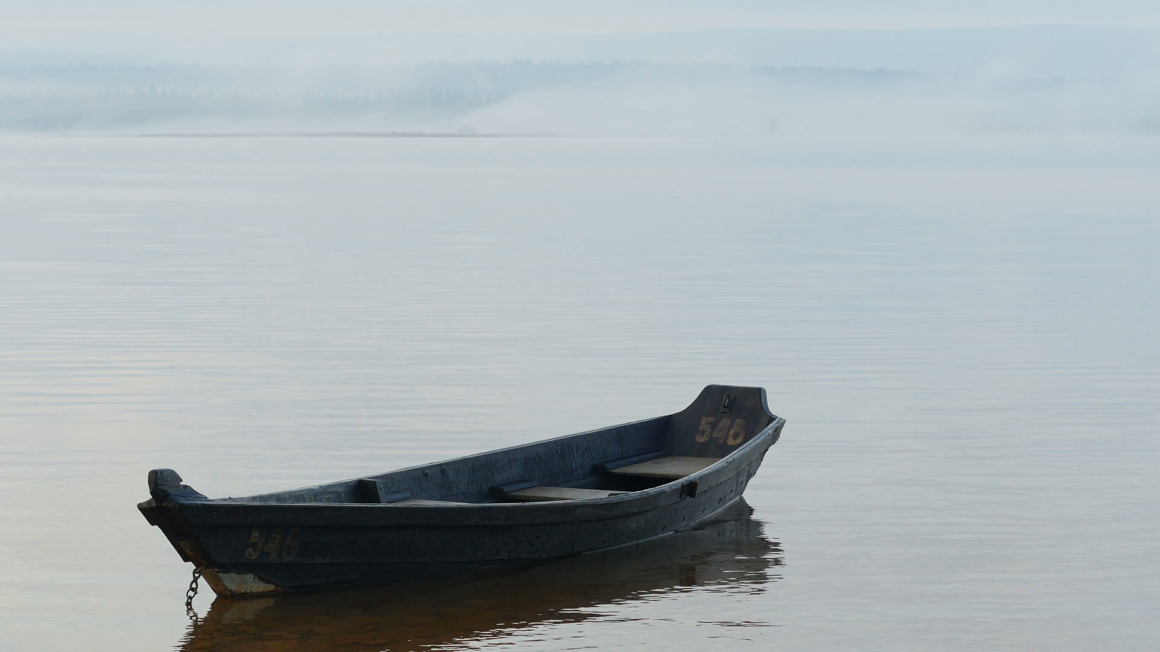 Old small wooden boat on water. Stock Video Footage - VideoBlocks