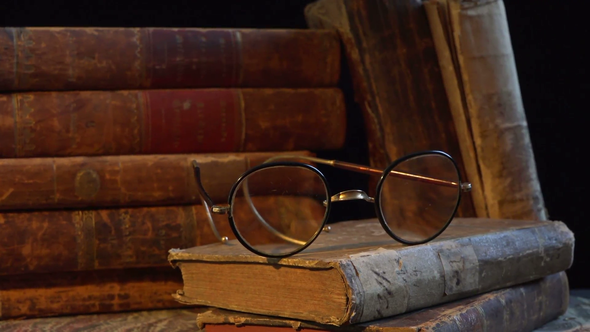 Old, aged and weathered books. A pair of old glasses. Stock Video ...