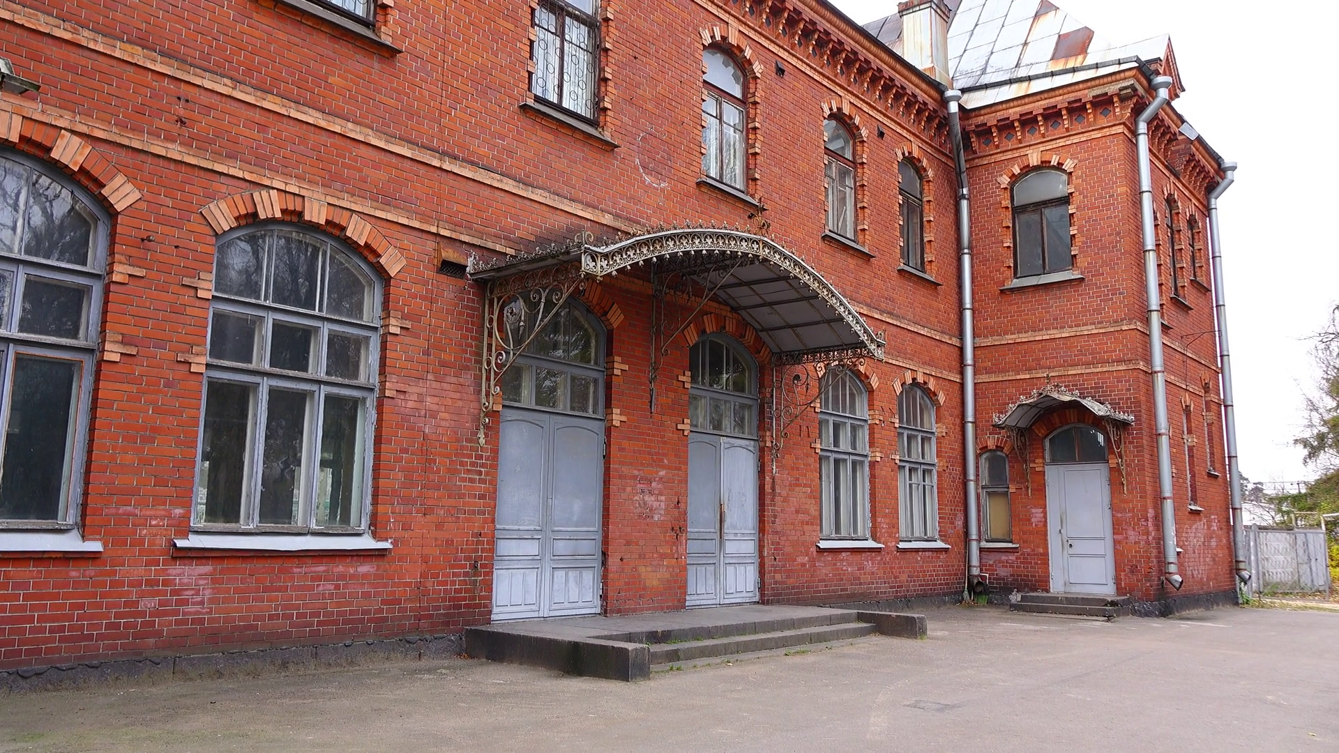 Old and empty red brick building of railway station, establishing ...