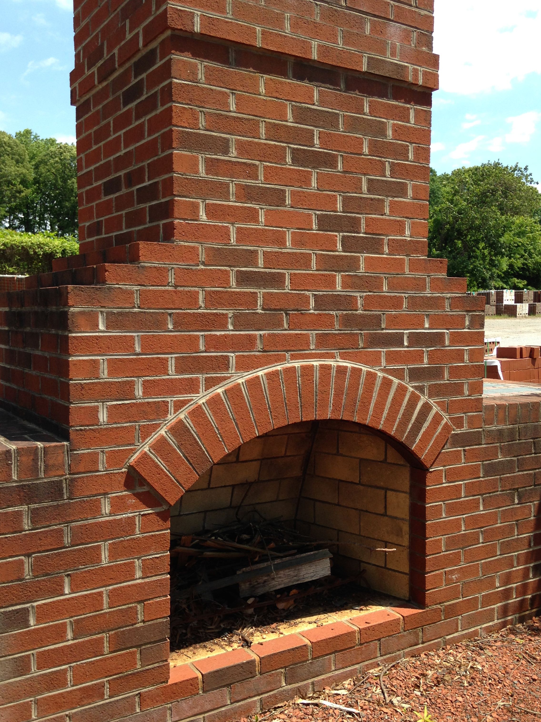 A classic outdoor fireplace constructed out of Old Colonial style ...