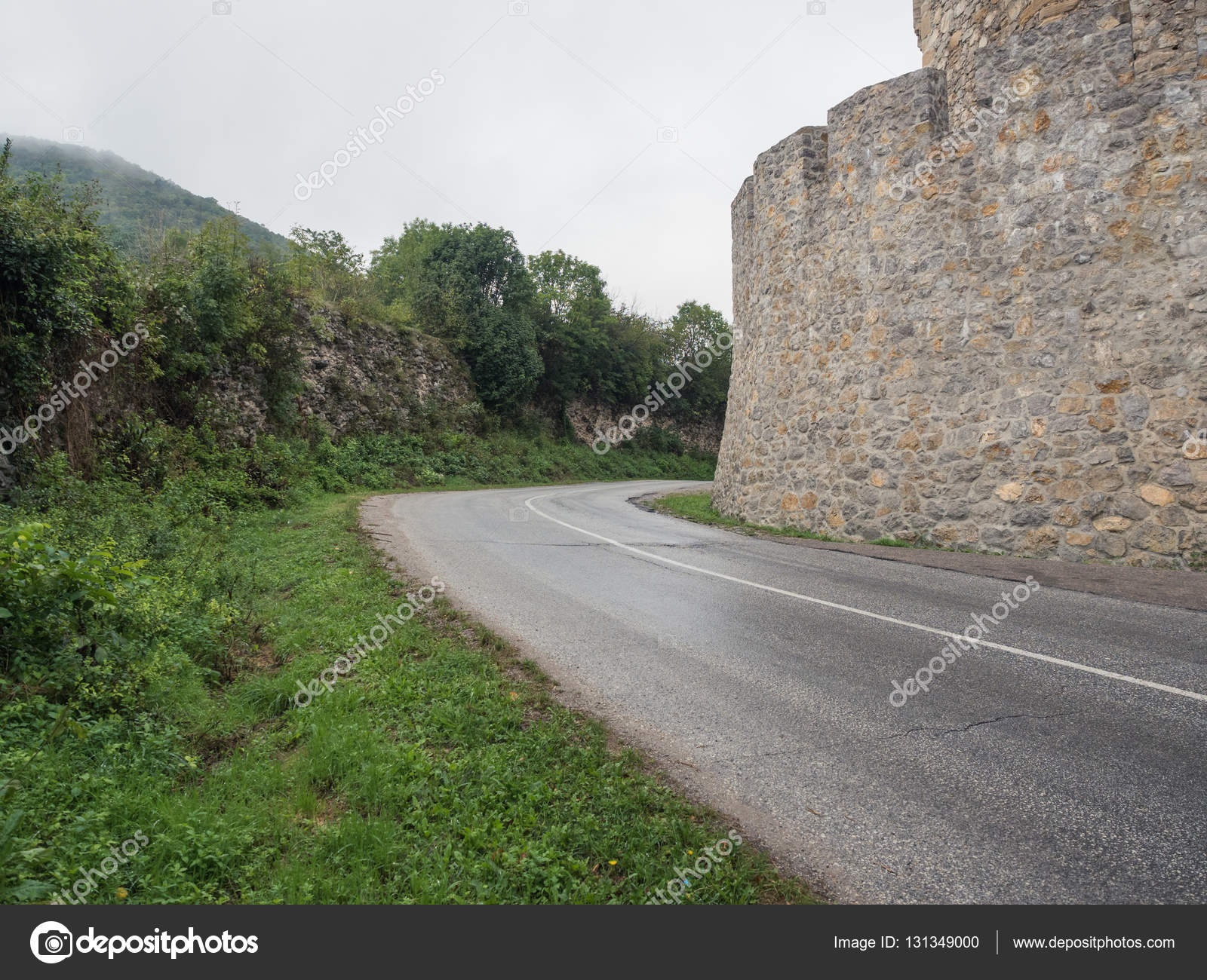 Road near the old castle wall — Stock Photo © master-erik #131349000