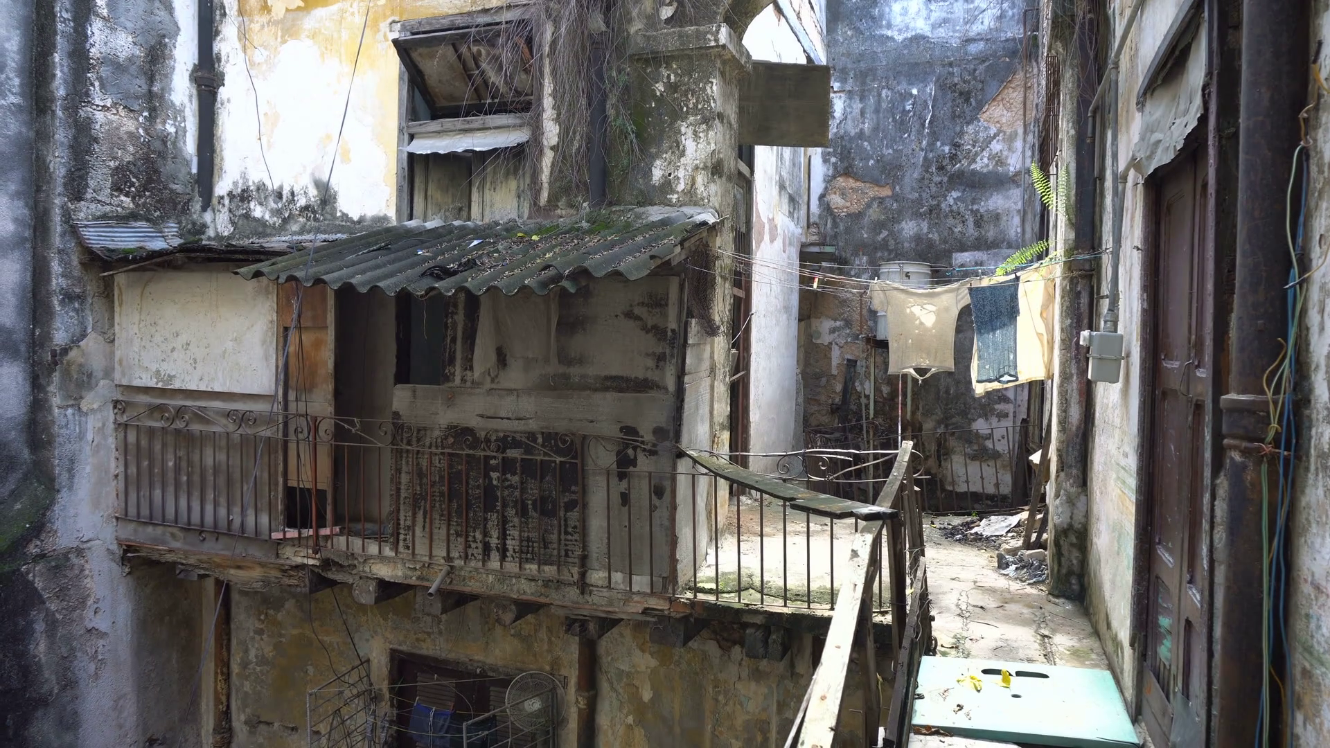 Inside the courtyard of battered old dirty house in a slum into ...