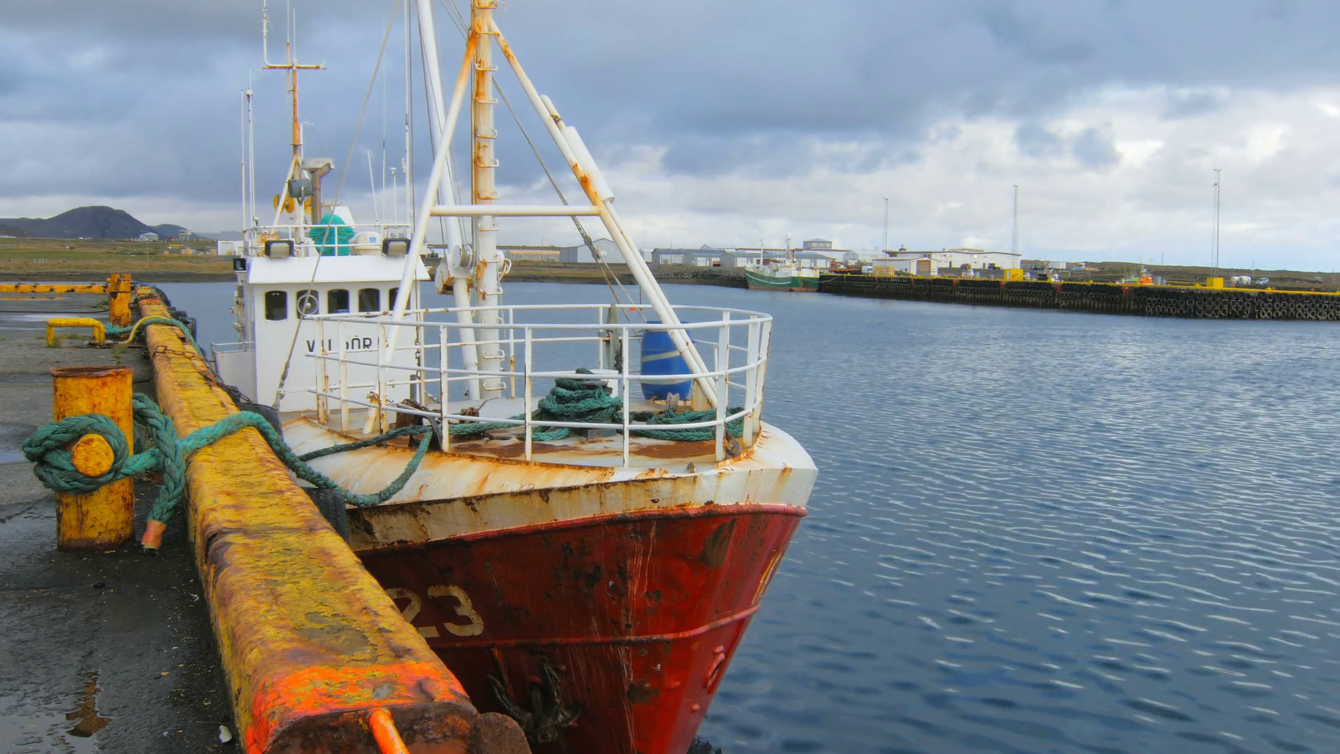 Old fishing boat is moored in Grindavik, Iceland, dock is on ...