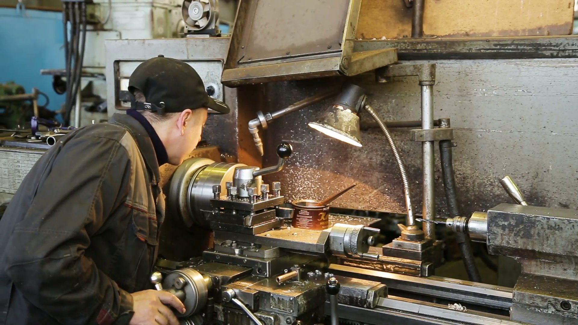 Turning lathe in action. Facing operation of a metal blank on ...