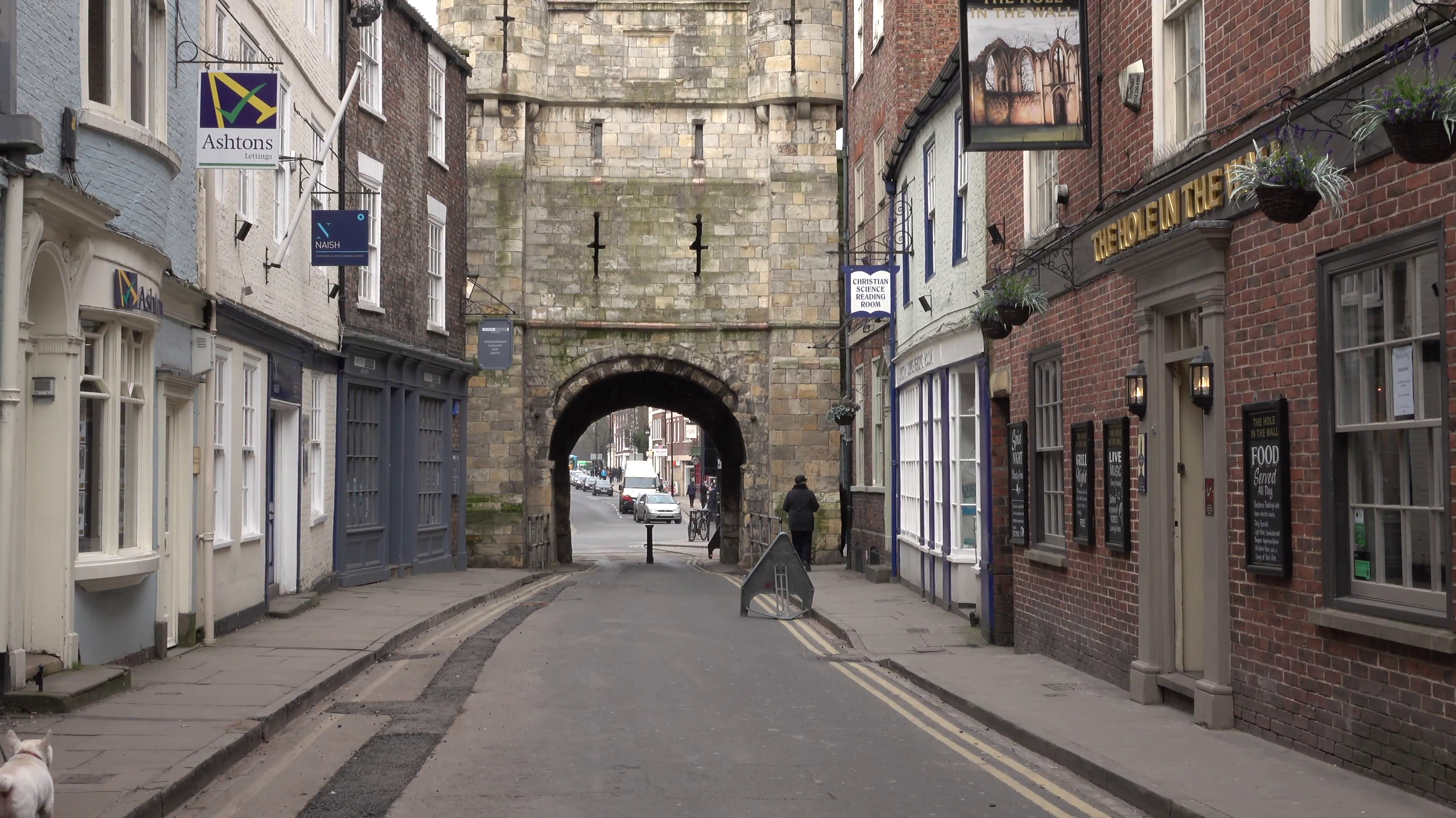 York England old town ancient stone arch couple with dog 4K 027 ...