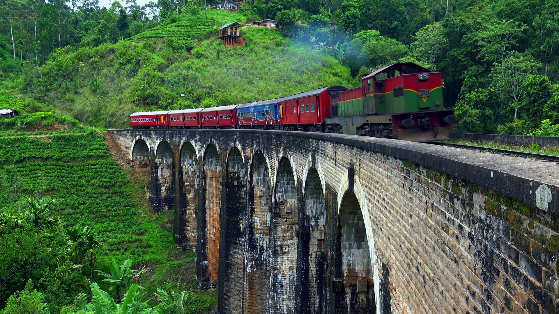 ELLA, SRI LANKA - March 11, 2016: Old train passing by 100 years old ...
