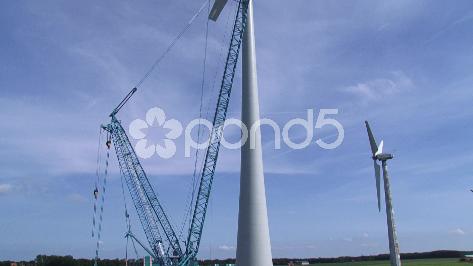 Video: Tilt up old and new wind turbine at construction site ~ #52513419