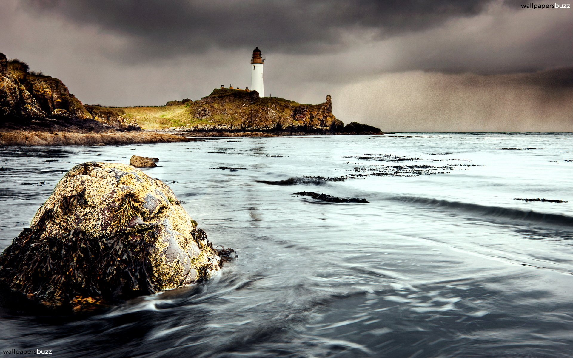 Lighthouse on the shore HD Wallpaper