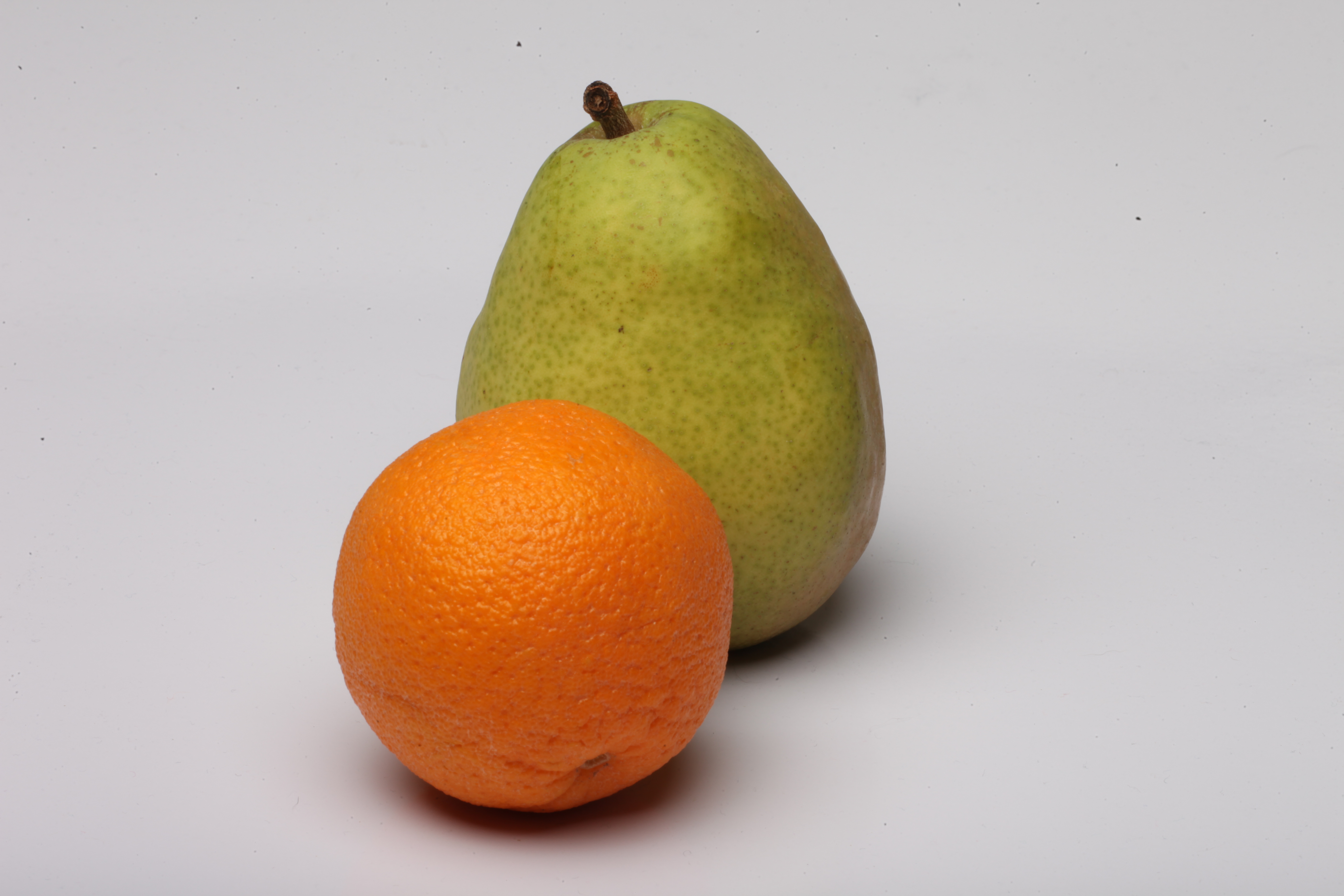 Orange and pear isolated on white. photo