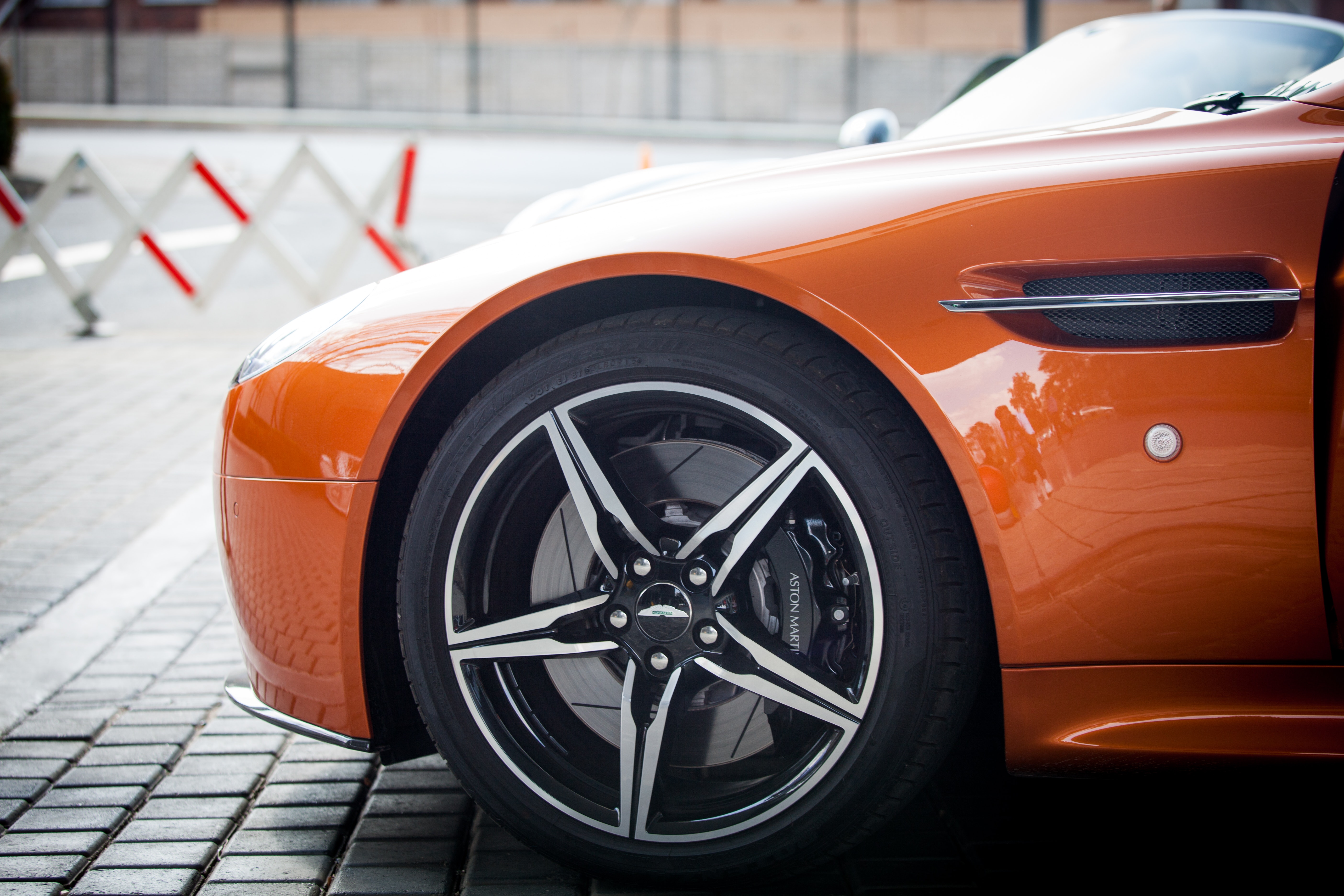 Orange Car Parked Near Grey Triangular Sign during Daytime, Aston martin, Automobile, Automotive, Car, HQ Photo