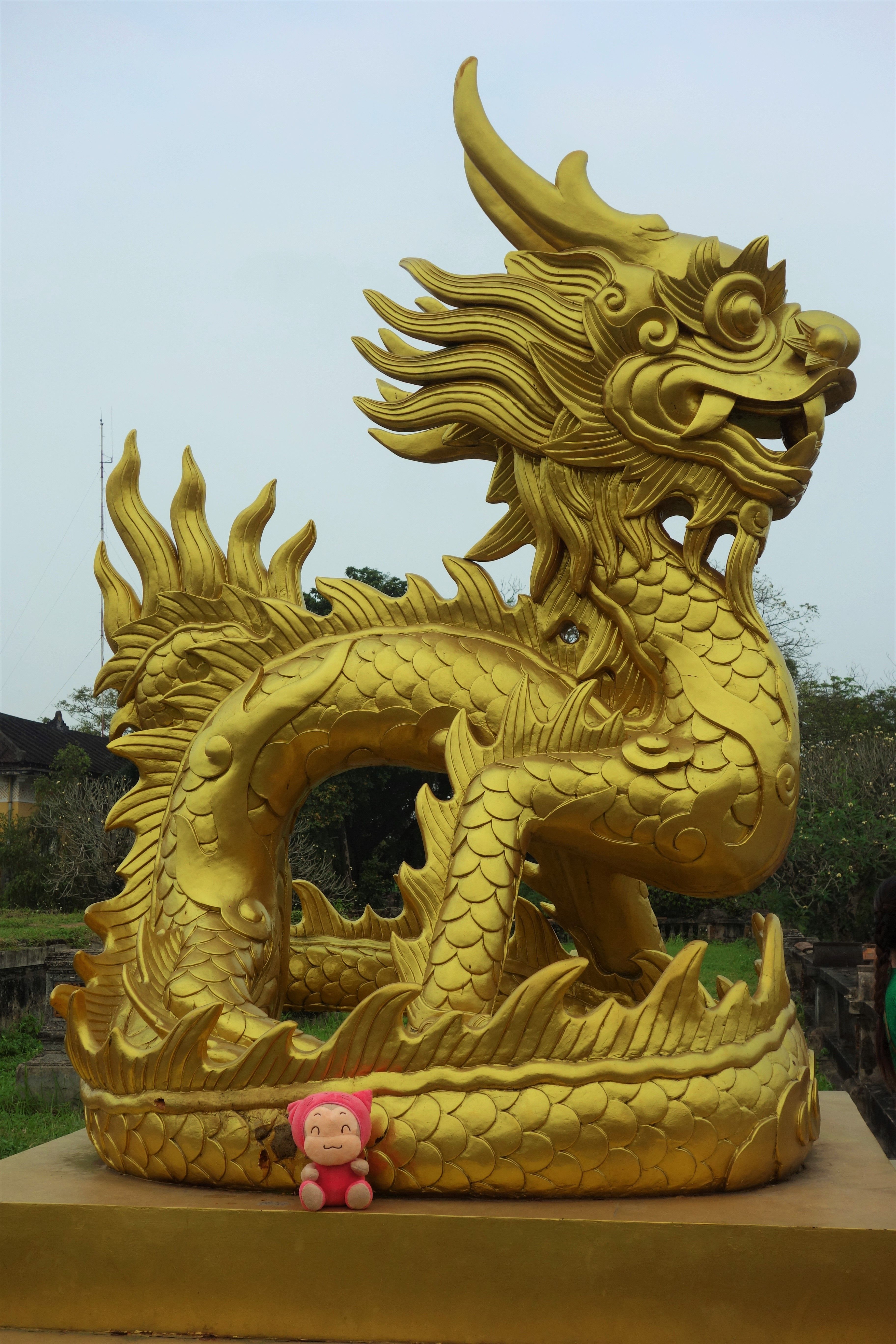 Travel Mascot in Vietnam in front of dragon statue. Travel Blog ...