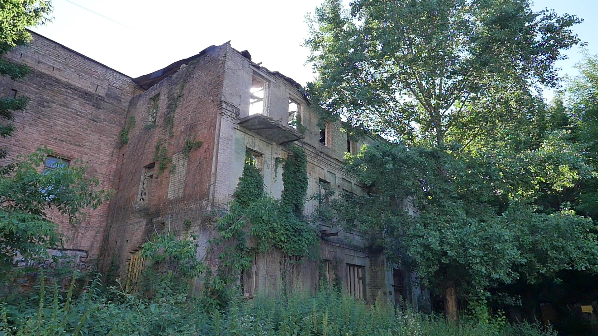 Sun Shines Over Lovely Abandoned Bricks Buildings Overgrown With ...