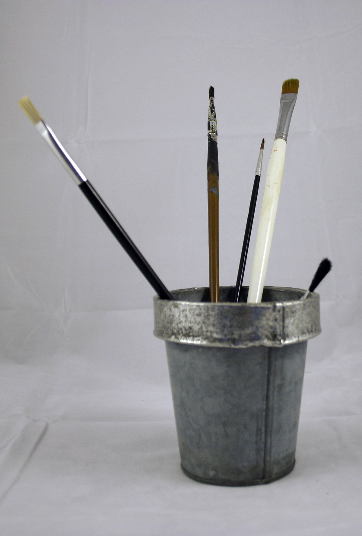 Paint brushes in tin can photo
