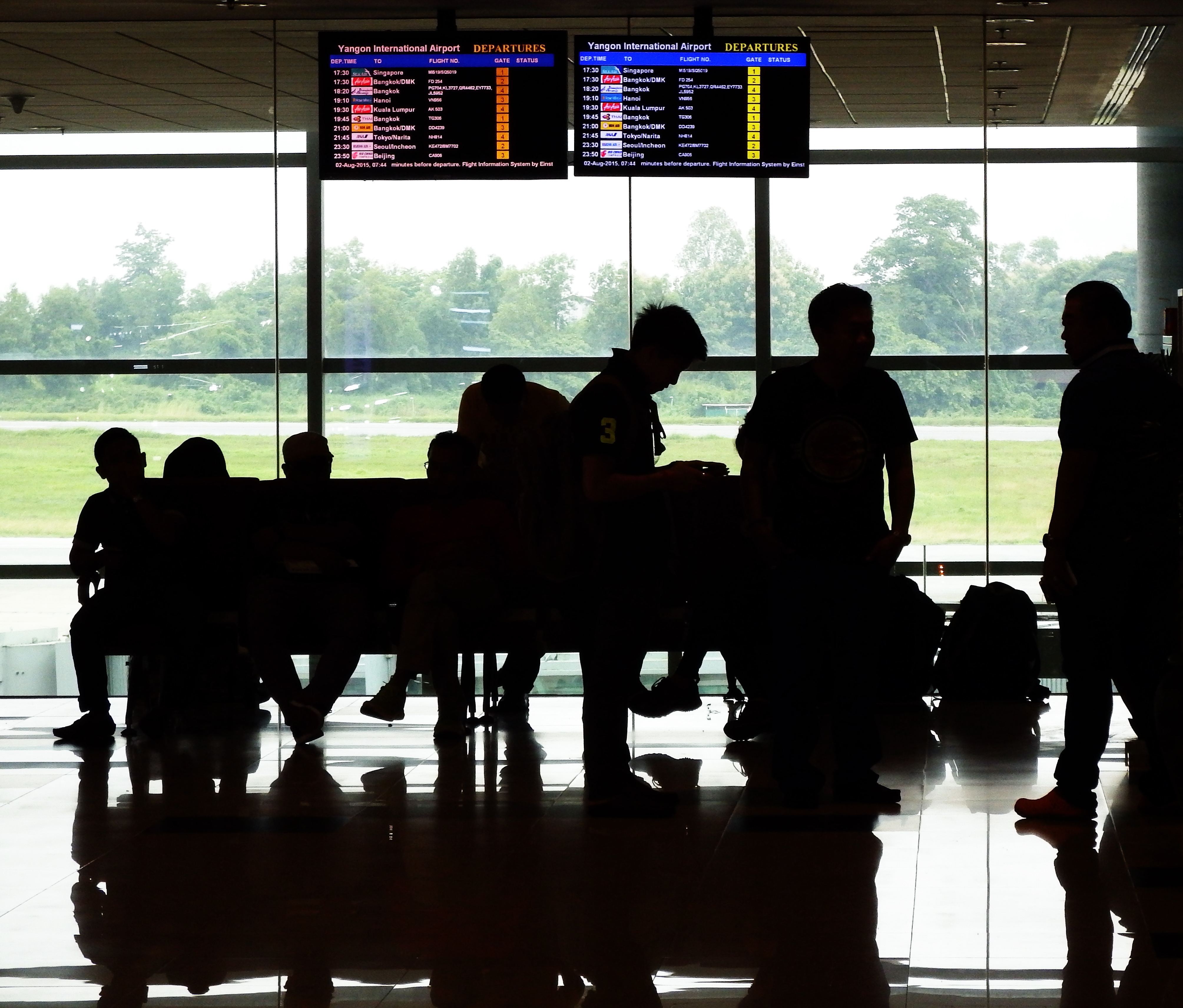 Passenger silhouettes at airport photo