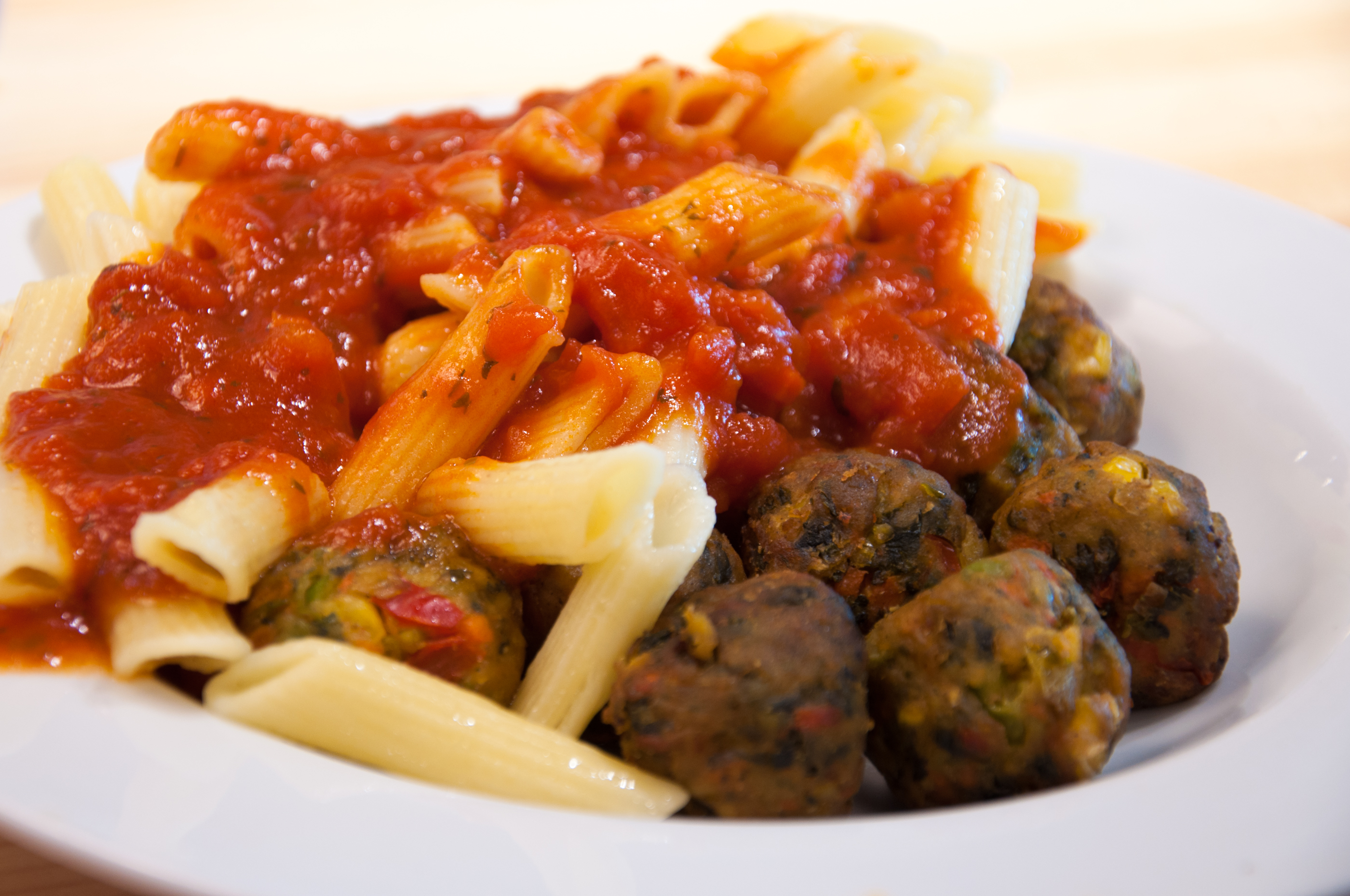 Pasta with meatballs and tomato sauce photo