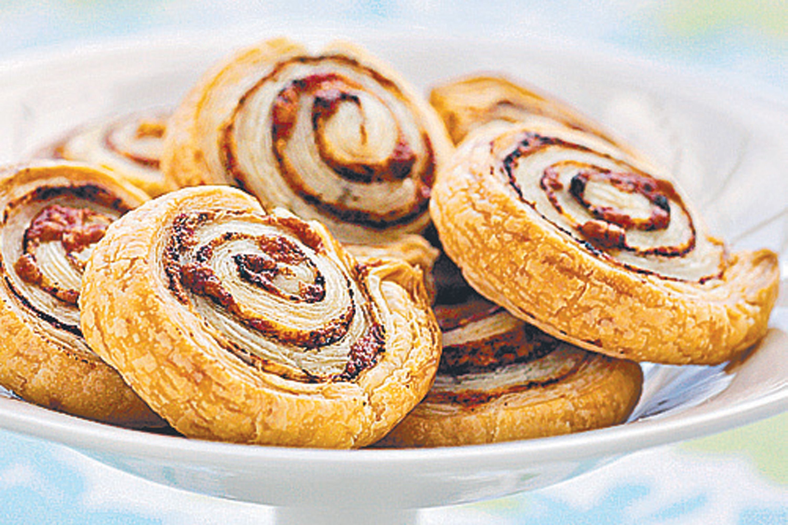 Puffy cheese and olive pastry swirls