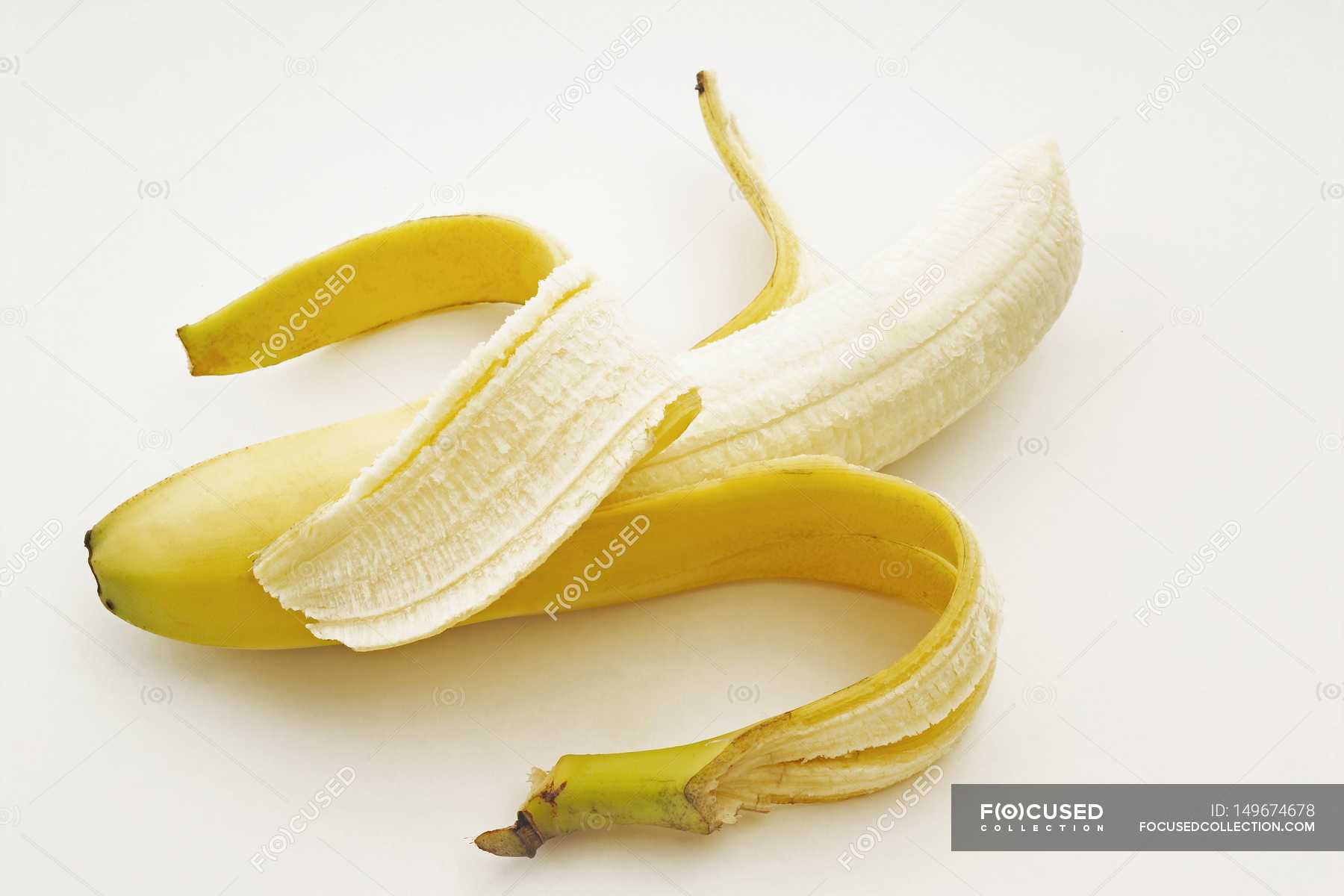 One Partially Peeled Banana — Stock Photo | #149674678