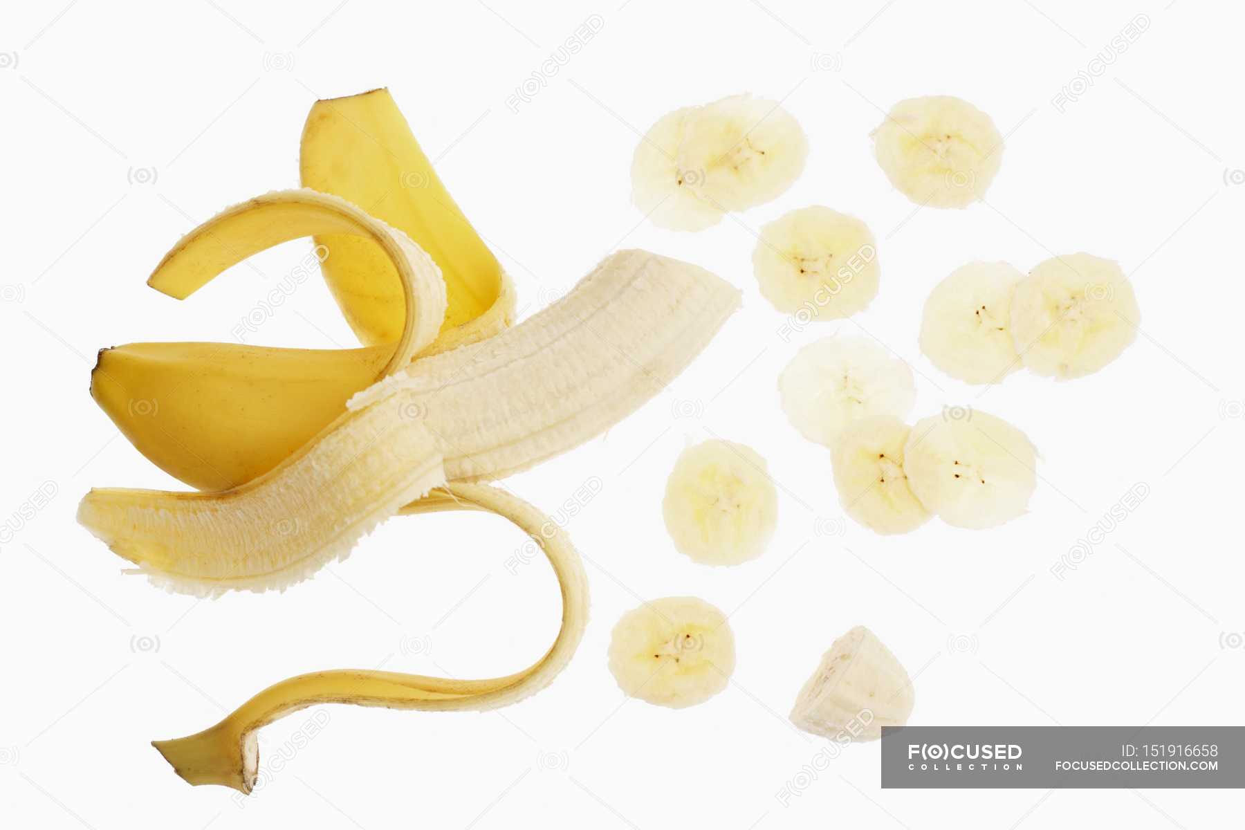 Half-peeled banana and slices — Stock Photo | #151916658