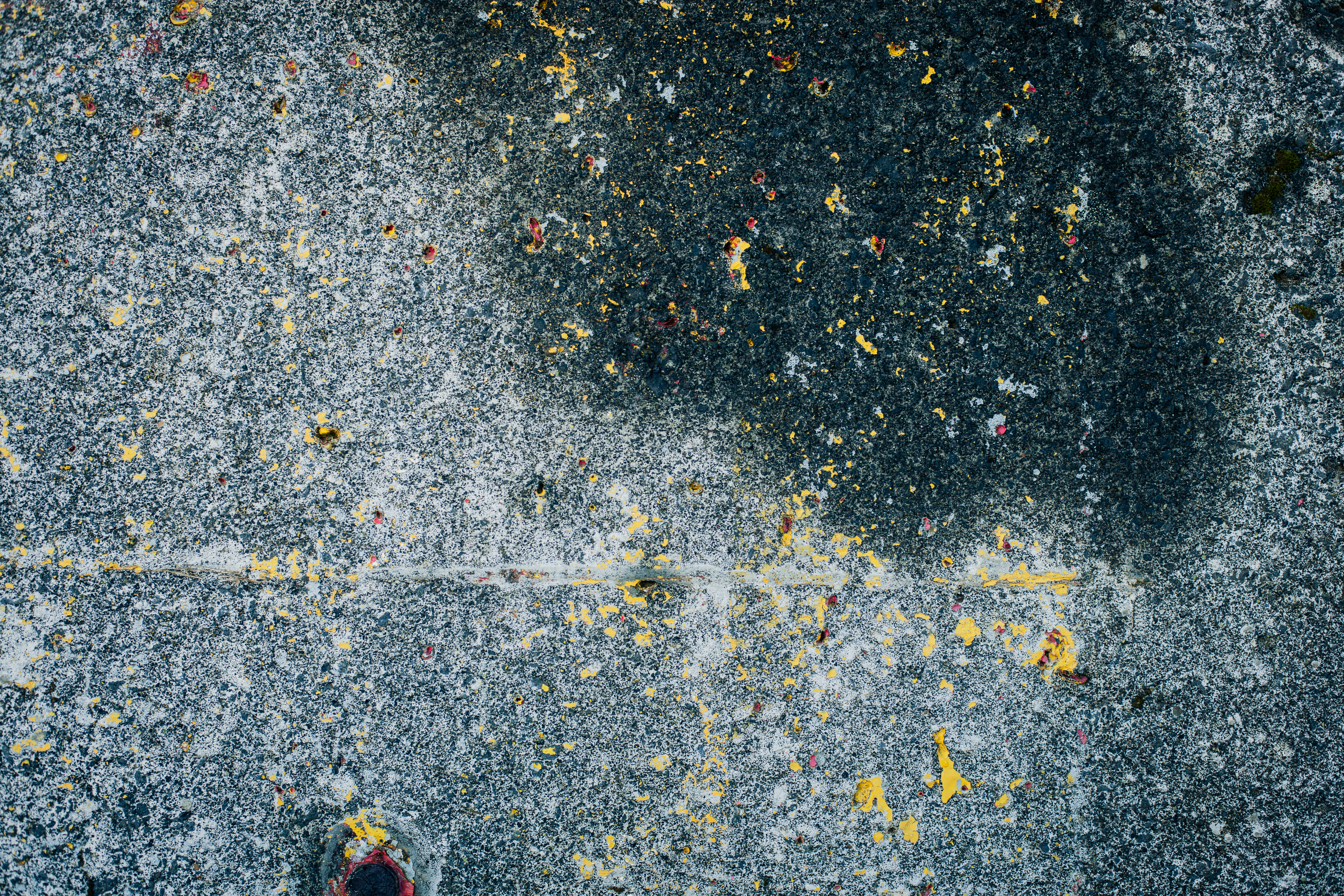Peeled yellow paint on concrete photo