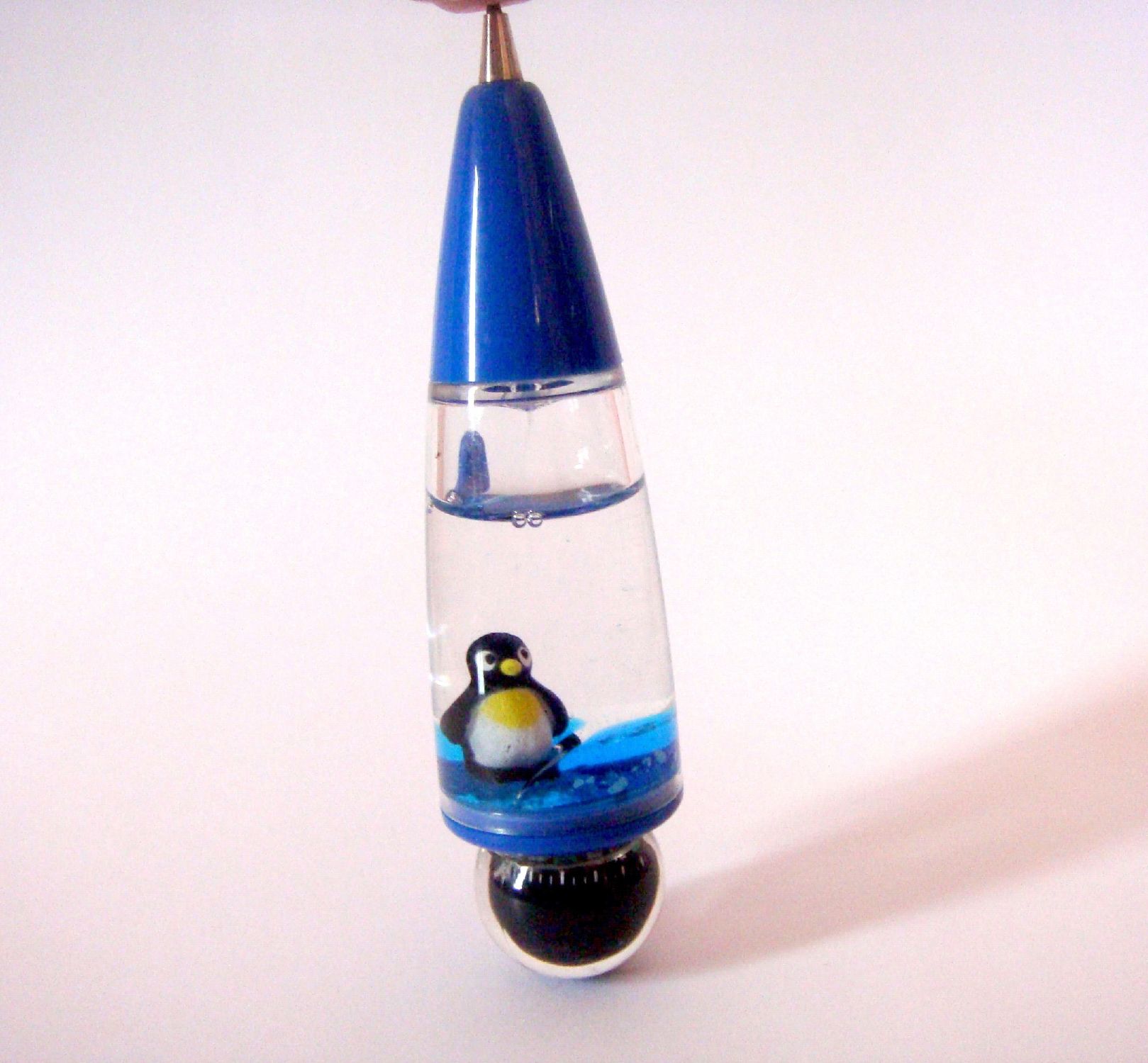 Penguin blue ball pen photo