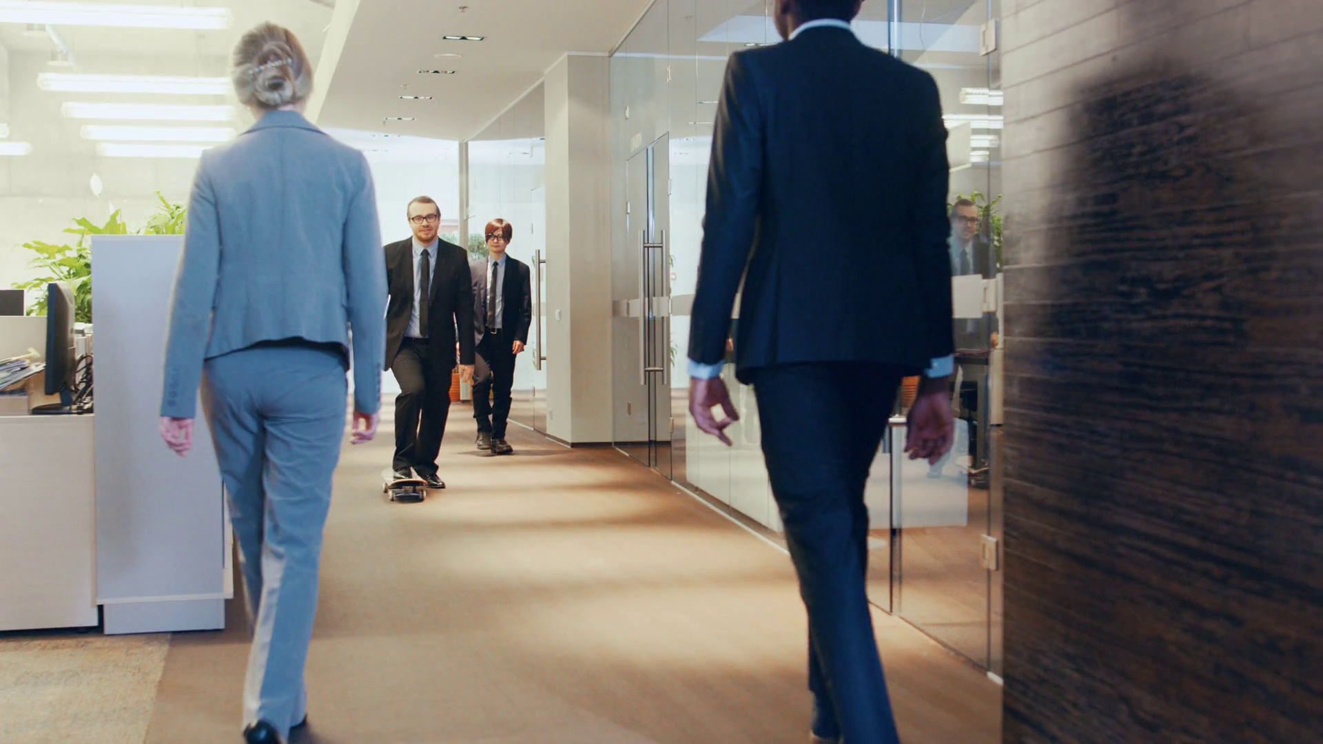 Stylish Suited Businessman Rides Skateboard Through the Corporate ...