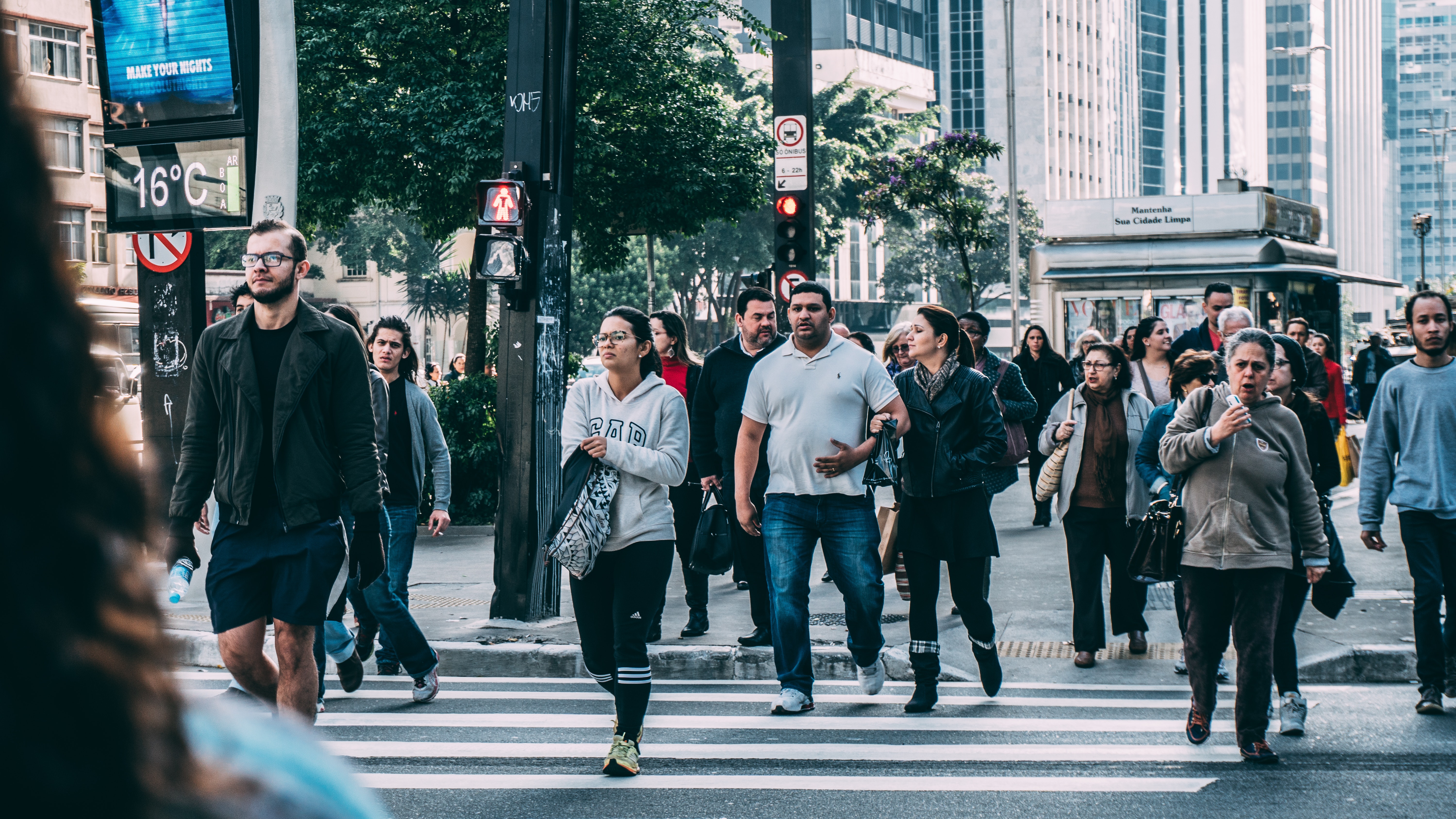 People walking on pedestrian lane during daytime photo
