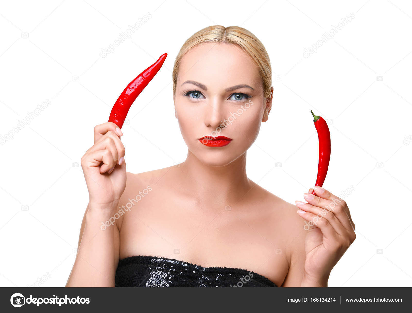 woman posing with red chili peppers — Stock Photo © belchonock ...