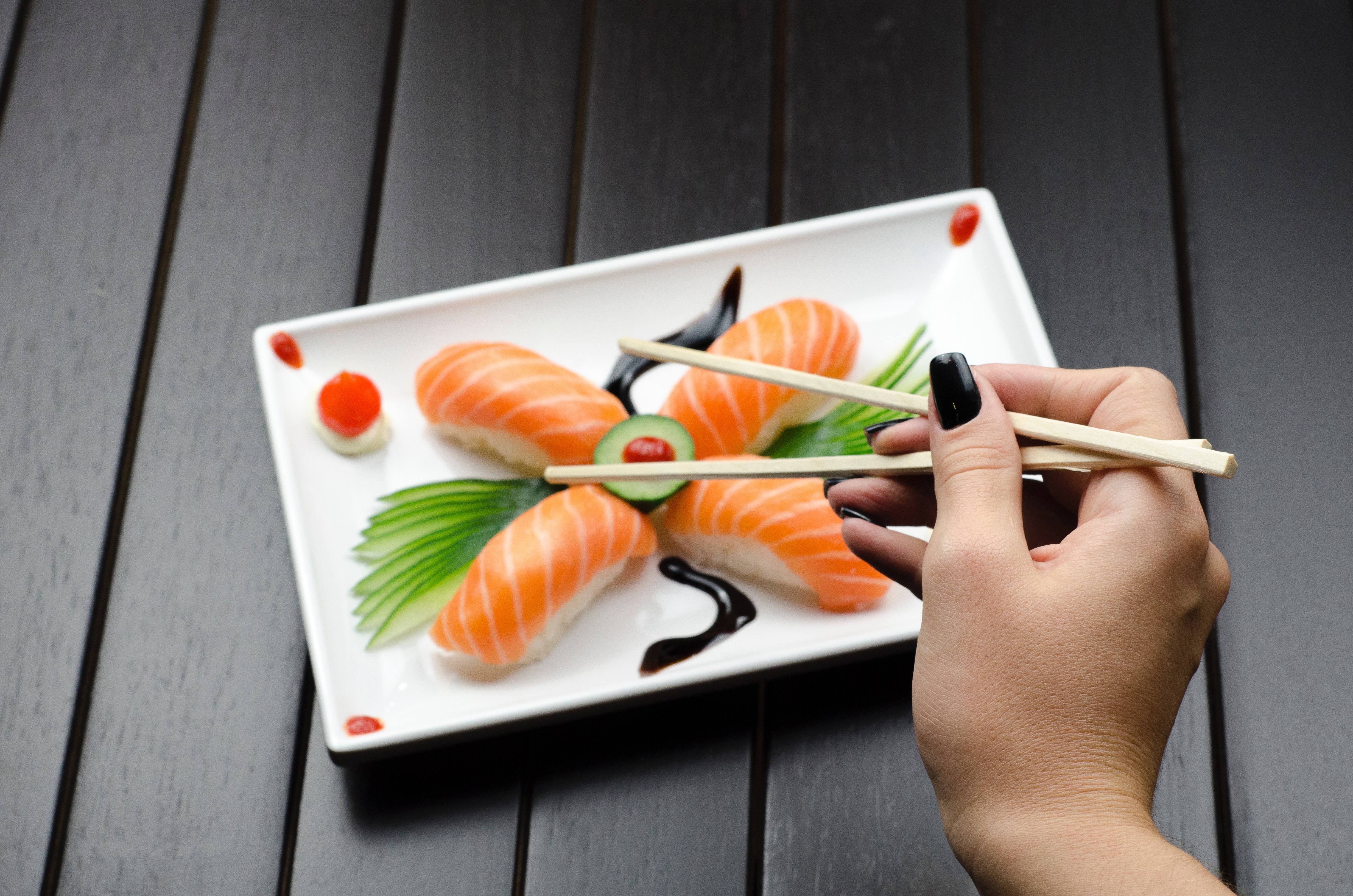 Person Eating Sushi, Chopsticks, Person, Wooden table, Vegetables, HQ Photo