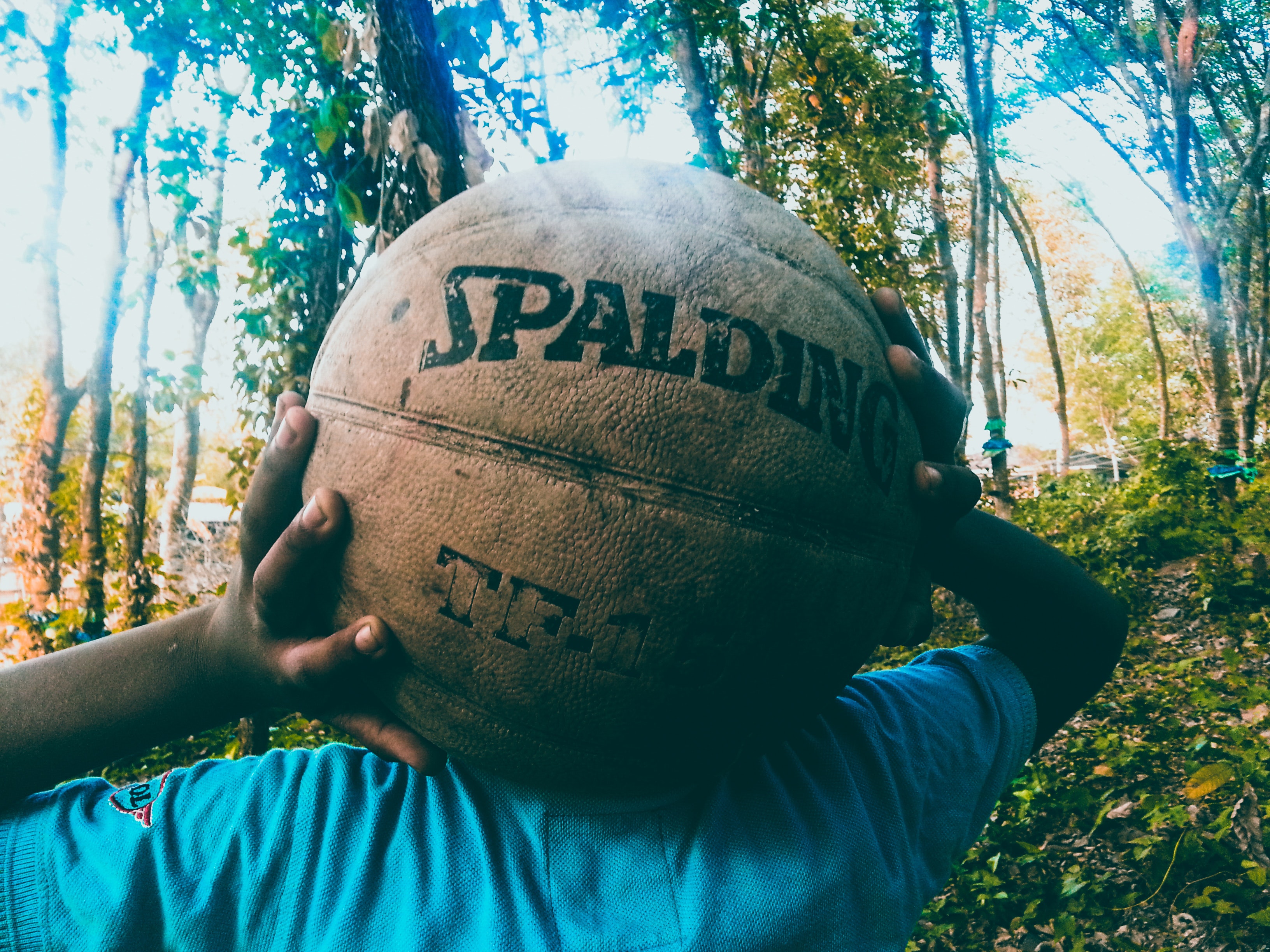 Person Holding Brown Spalding Basketball, Basketball, Child, Close -up, Daytime, HQ Photo