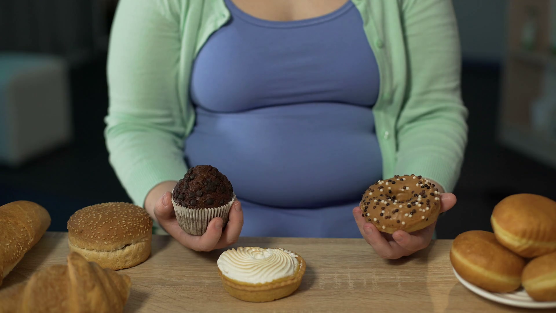 Obese teenager biting muffins and donuts, overeating sweets ...