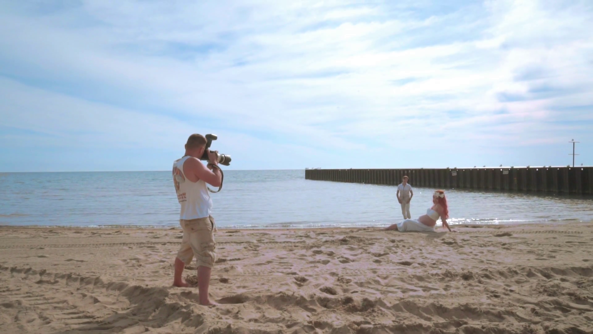 Photographer take photo of love couple on beach. Photo shooting of ...