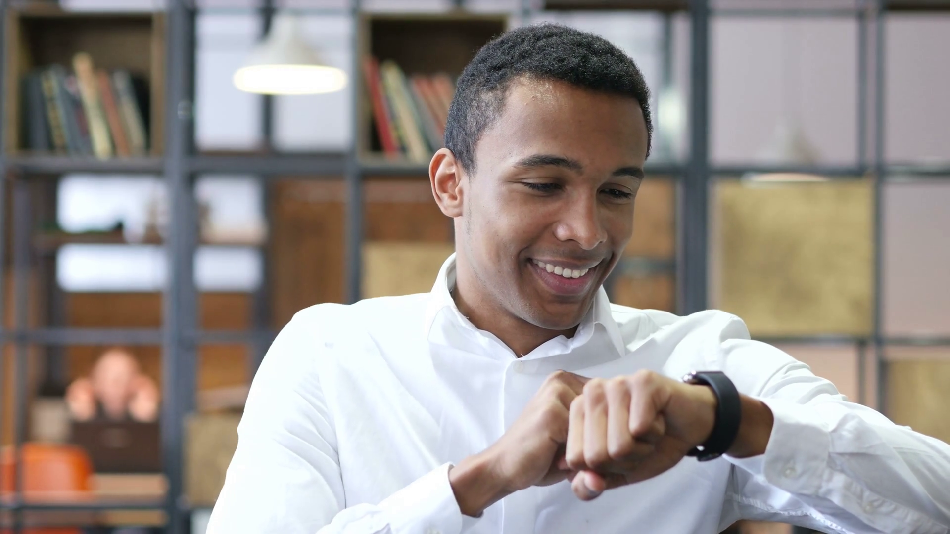 Black Man Using Smartwatch in Office Stock Video Footage - Videoblocks