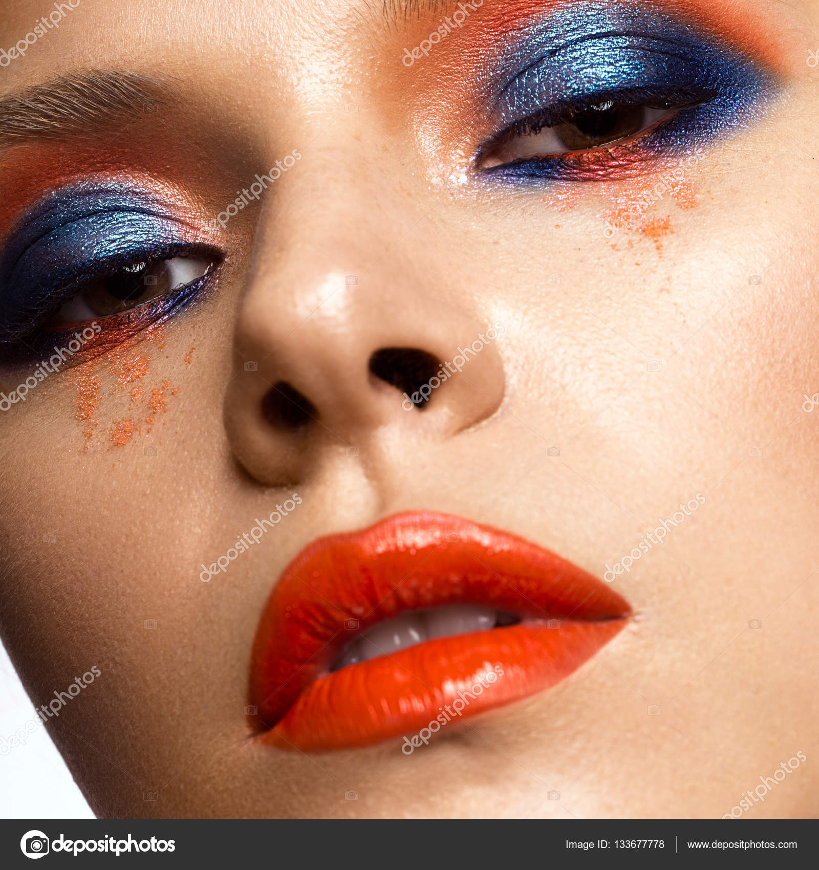 Beautiful girl with bright colored makeup and orange lips. Beauty ...