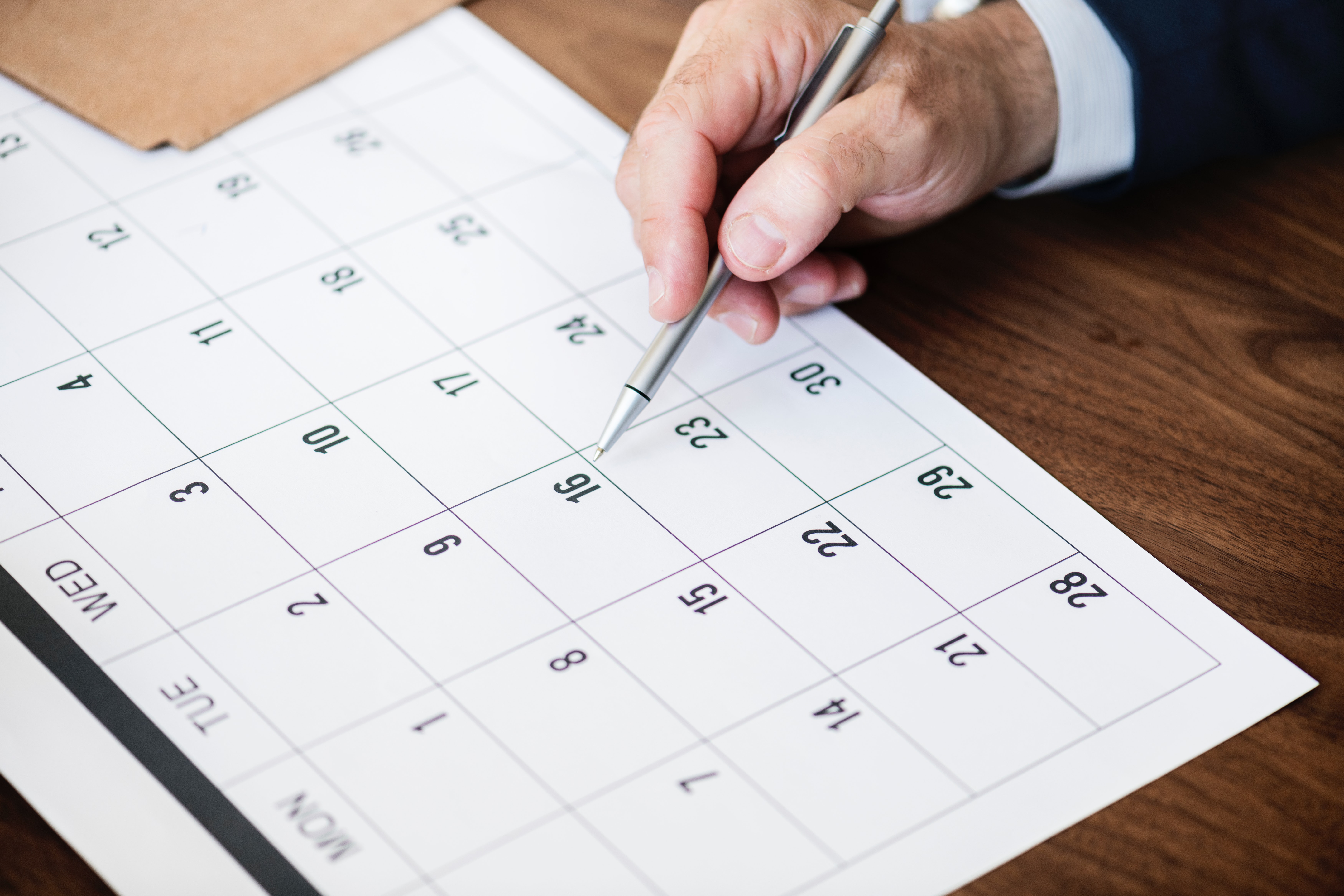 Person Pinpointing Pen on Calendar, Calendar, Close-up, Dates, Desk, HQ Photo