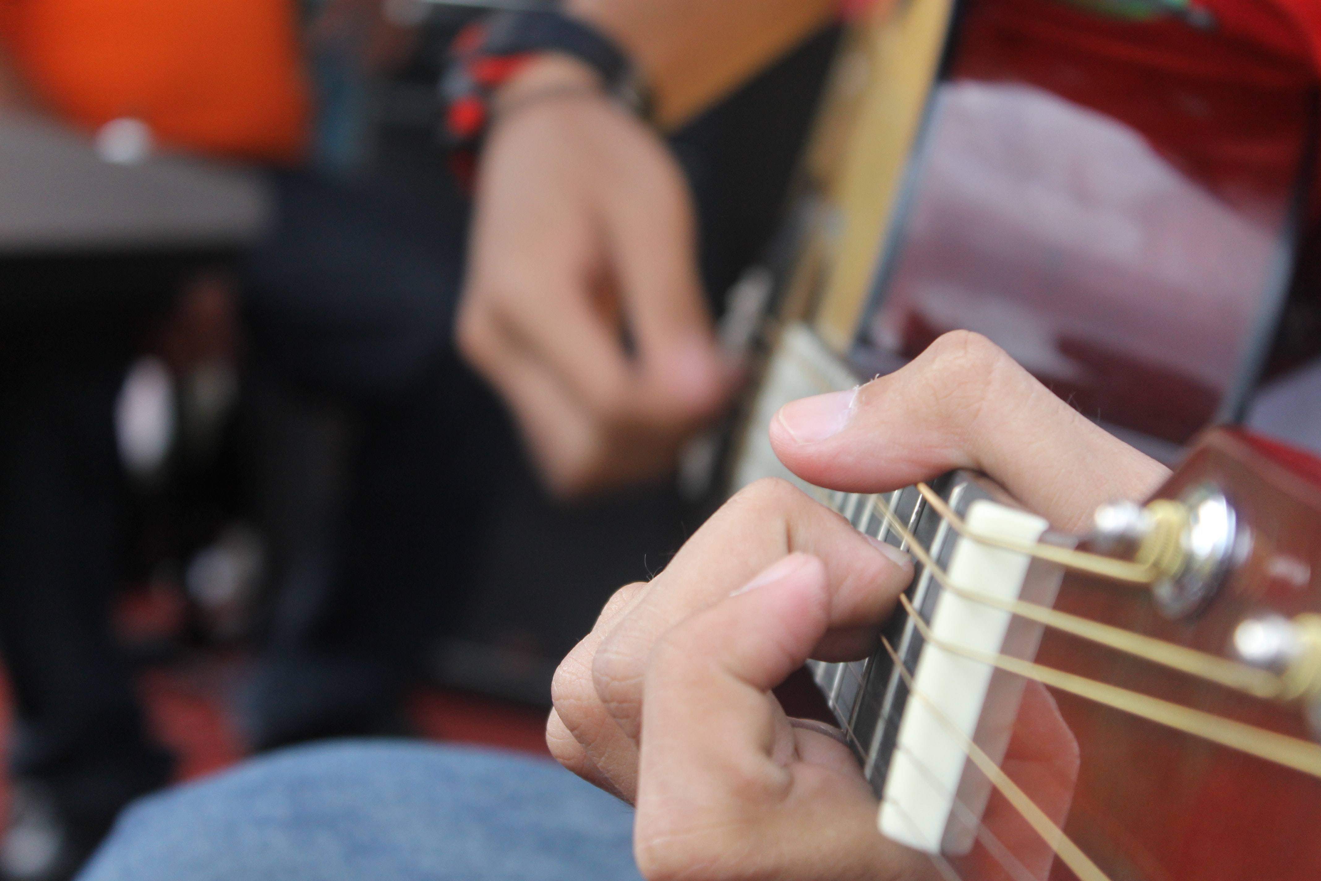Person playing guitar photo