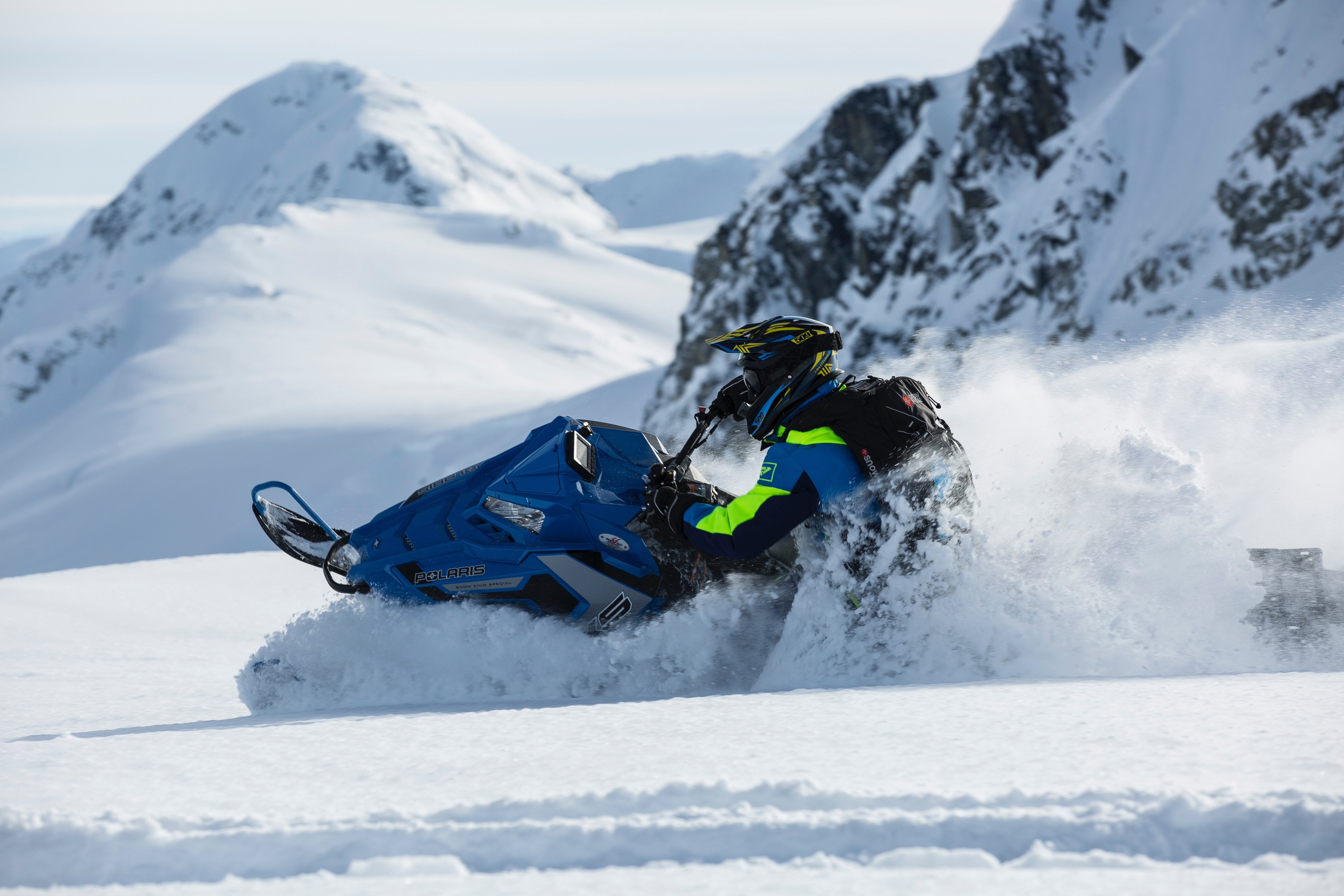 Person riding on snowmobile photo
