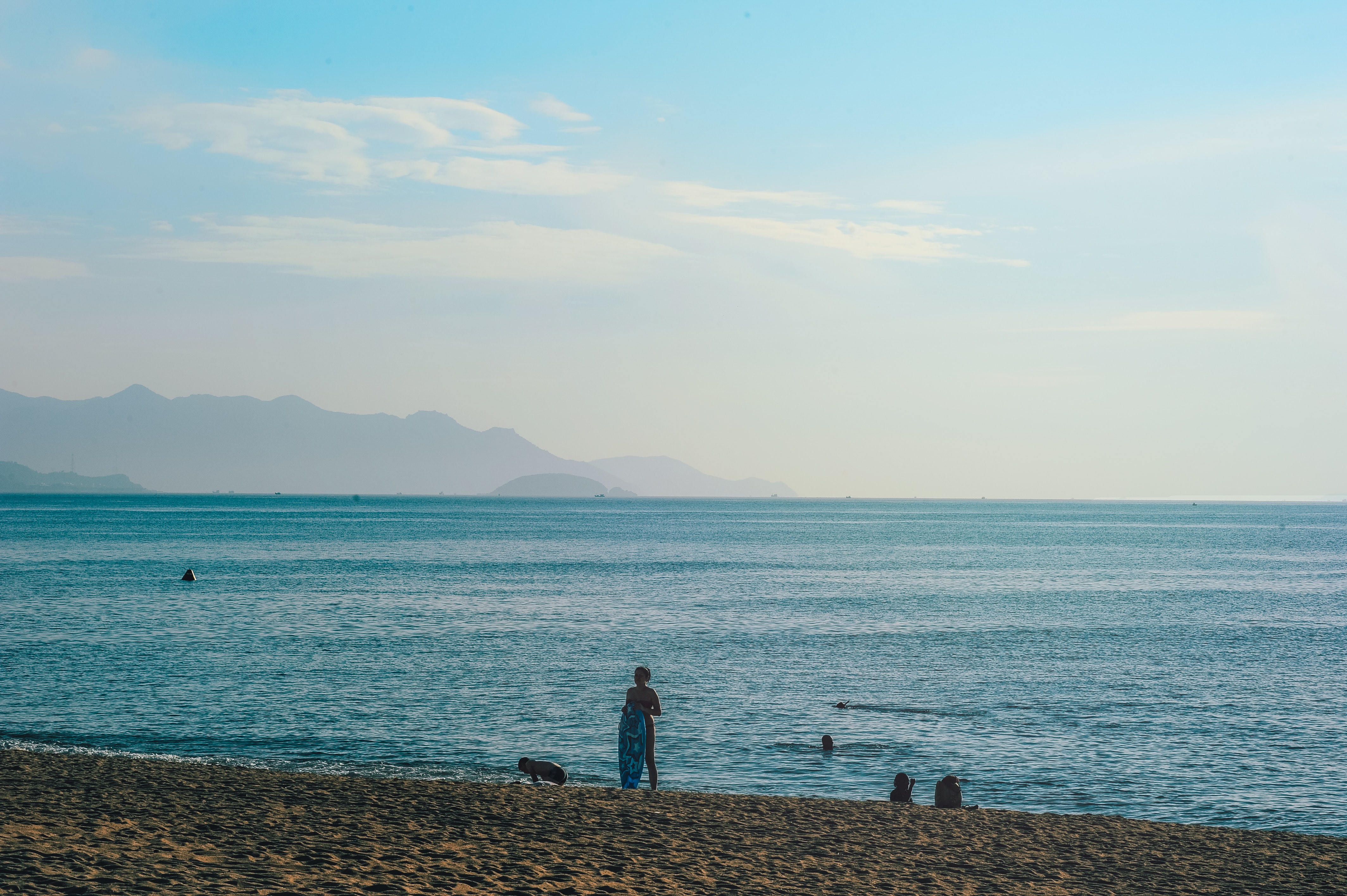 Person standing on seashore photo