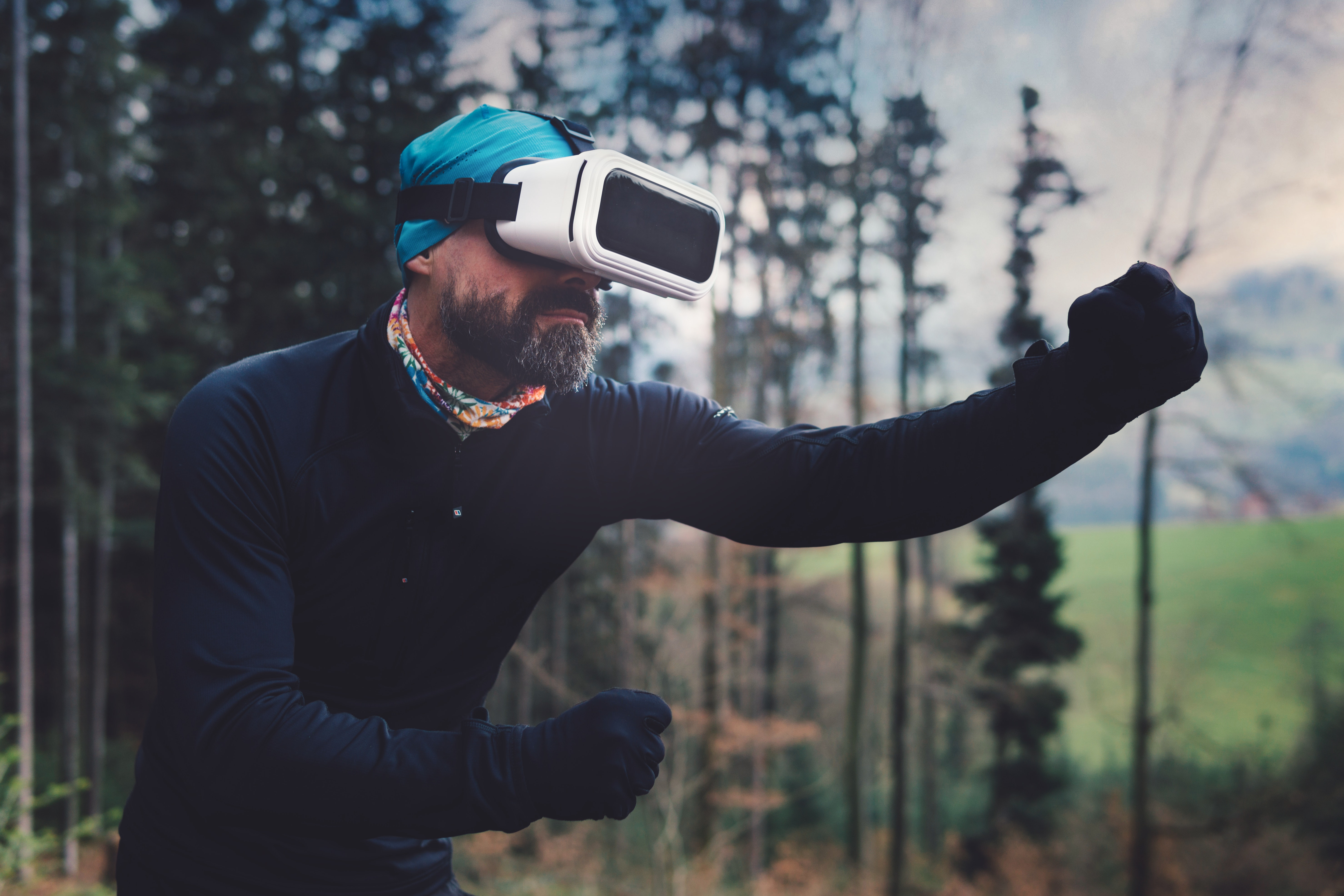 Person wearing black henley shirt and white vr goggles photo