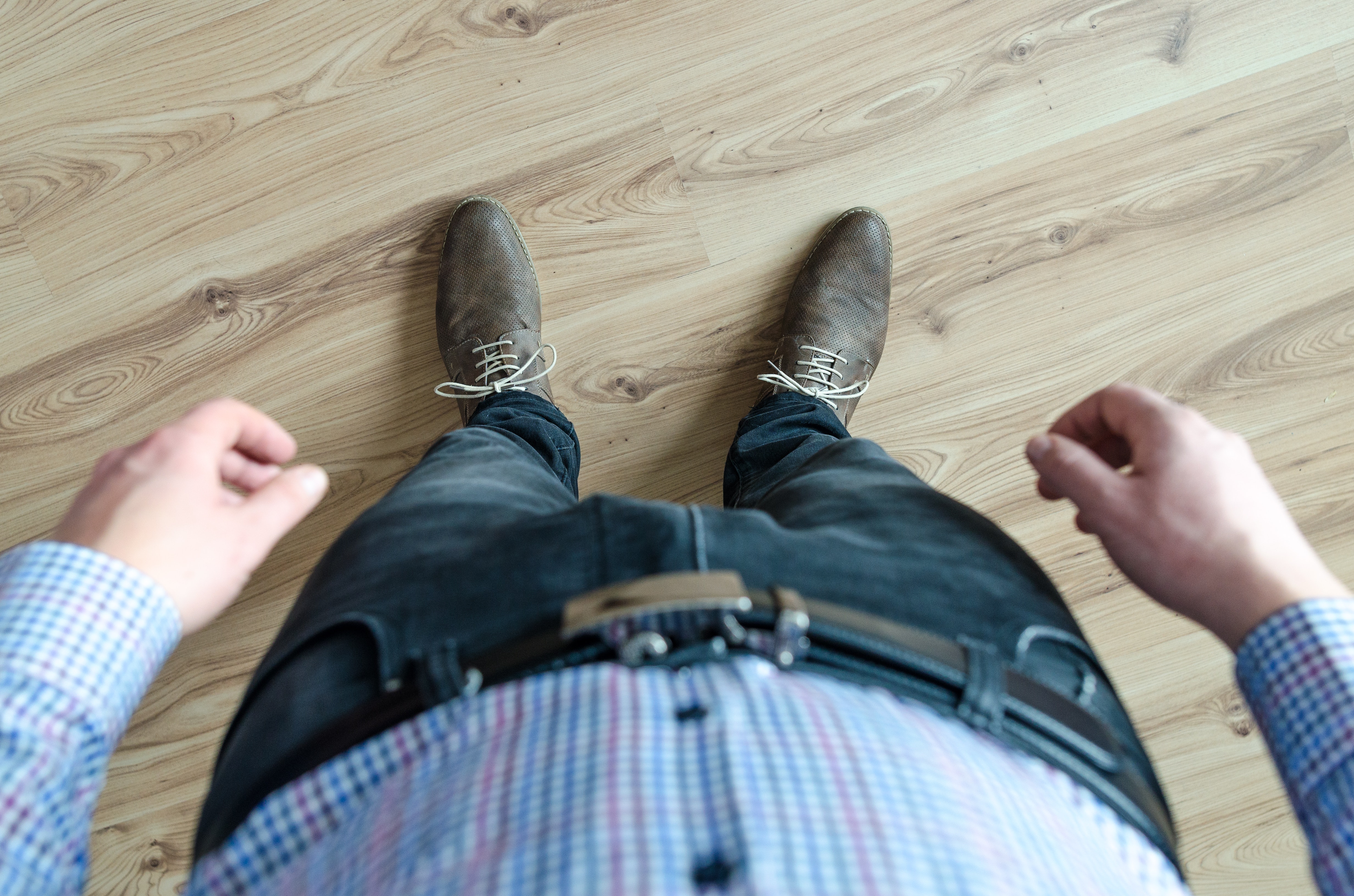 Person wearing black jeans while standing photo