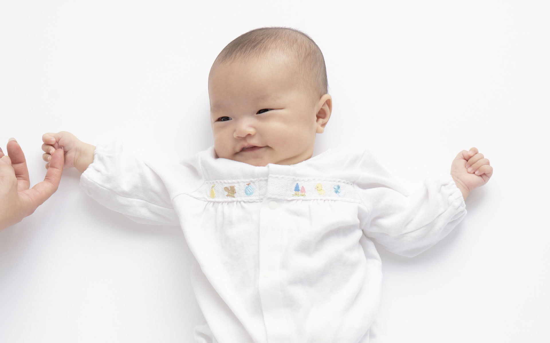 Baby in white long-sleeved shirt holding person's index finger HD ...