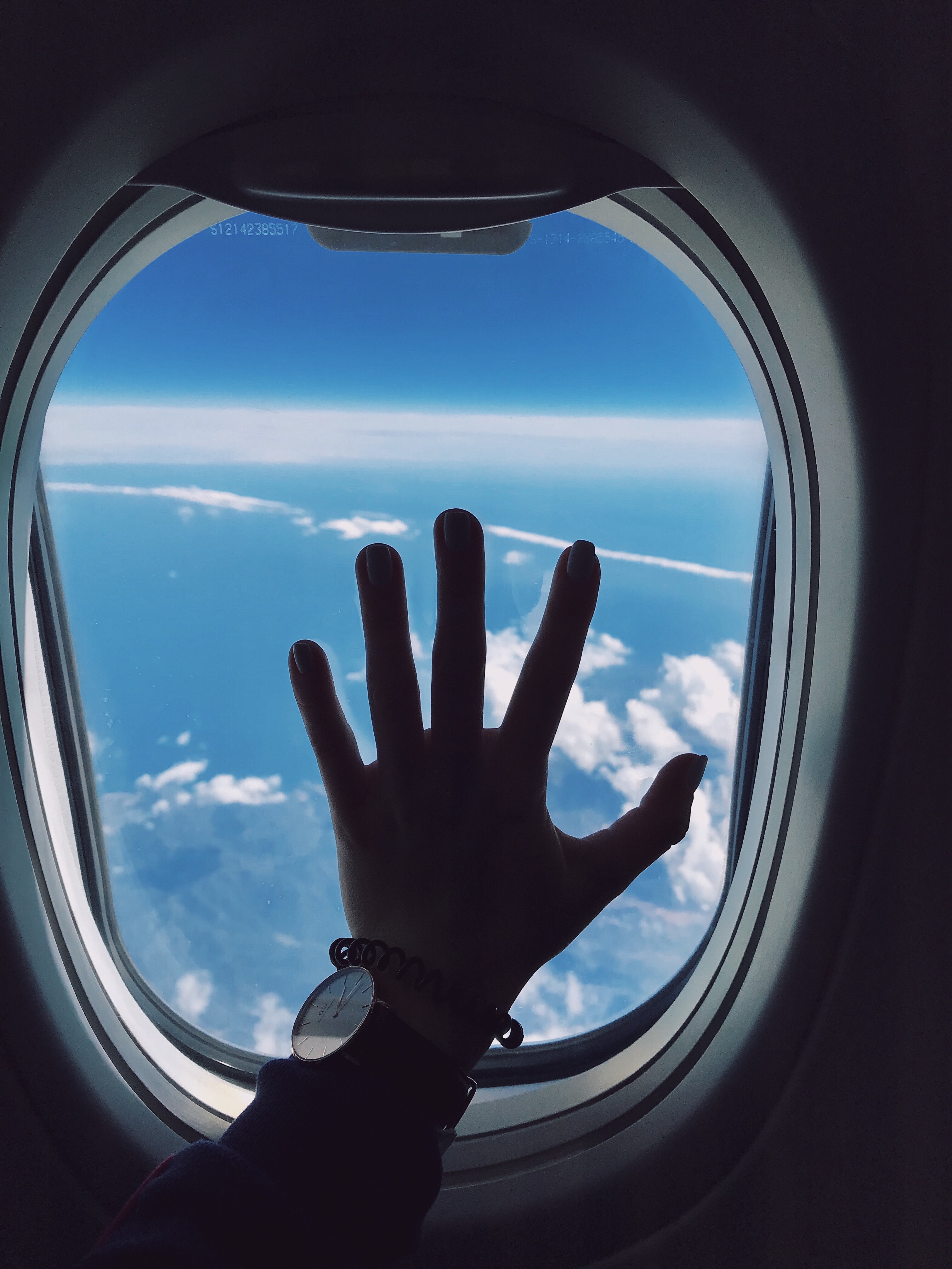 Photography of Person's Left Hand Touching an Airplane's Window ...