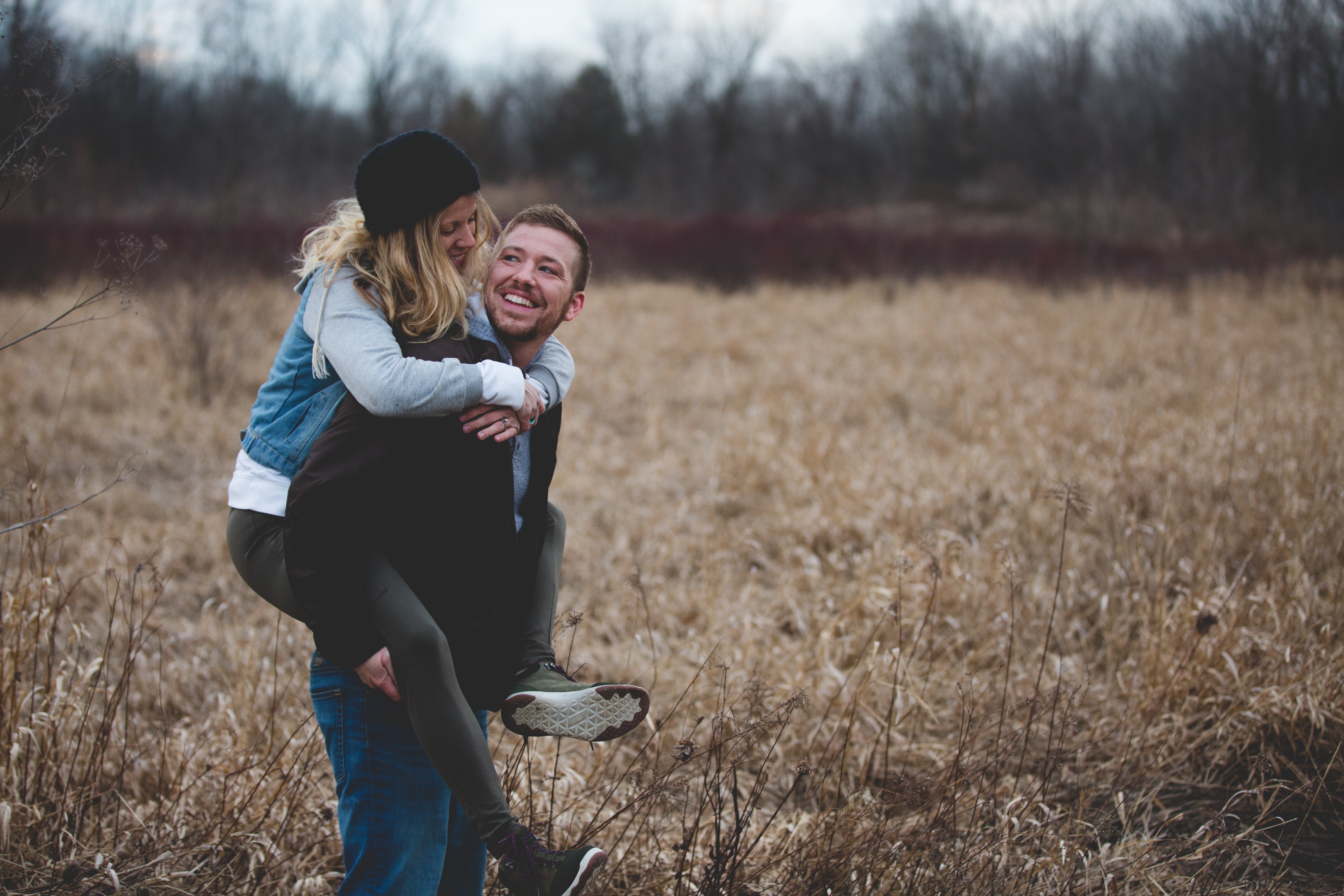 Photo of a Man Carrying His Partner, Adult, Outdoors, Joy, Laugh, HQ Photo