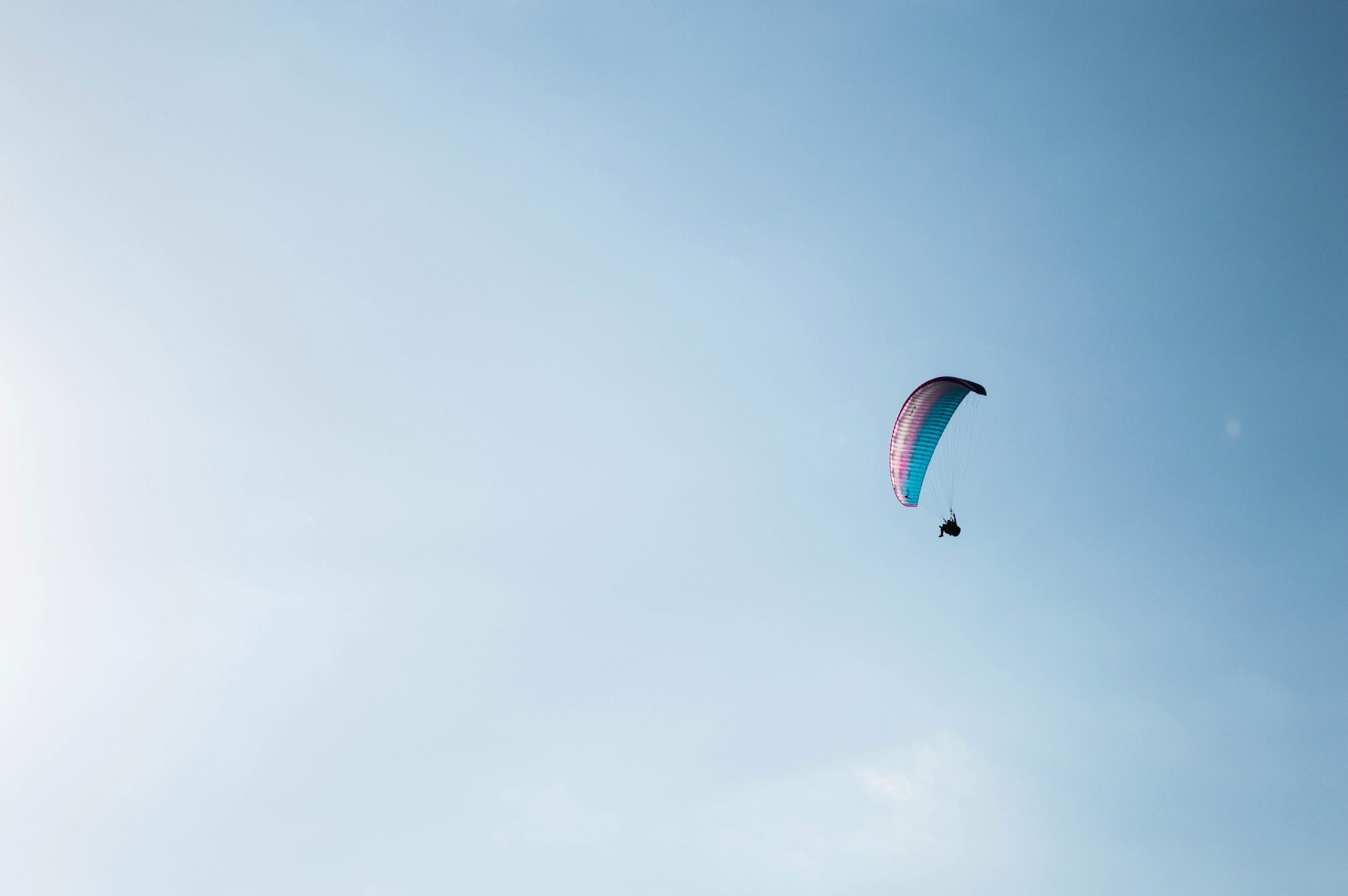 Photo of a person paragliding