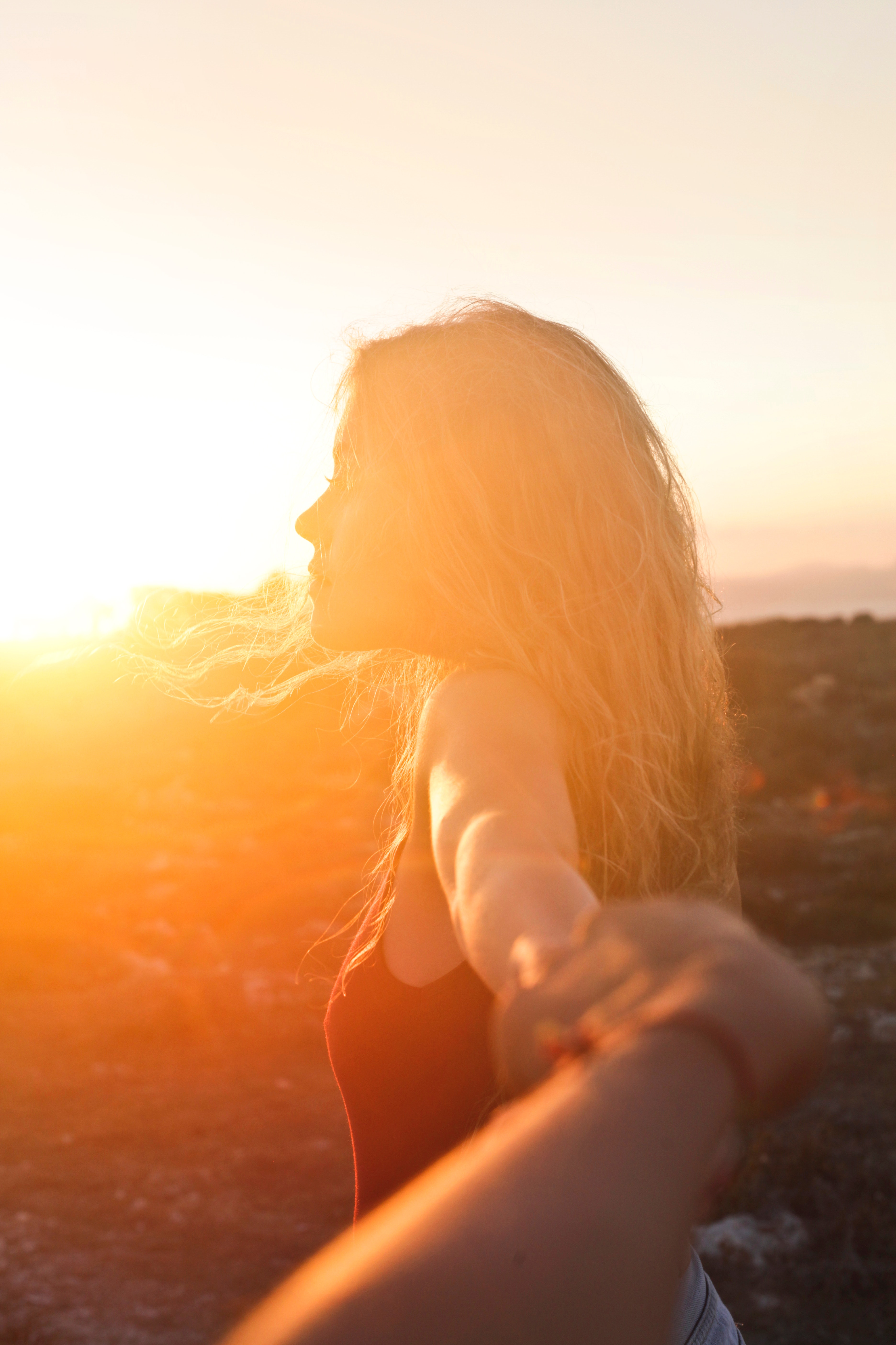 Photo of a woman at sunset