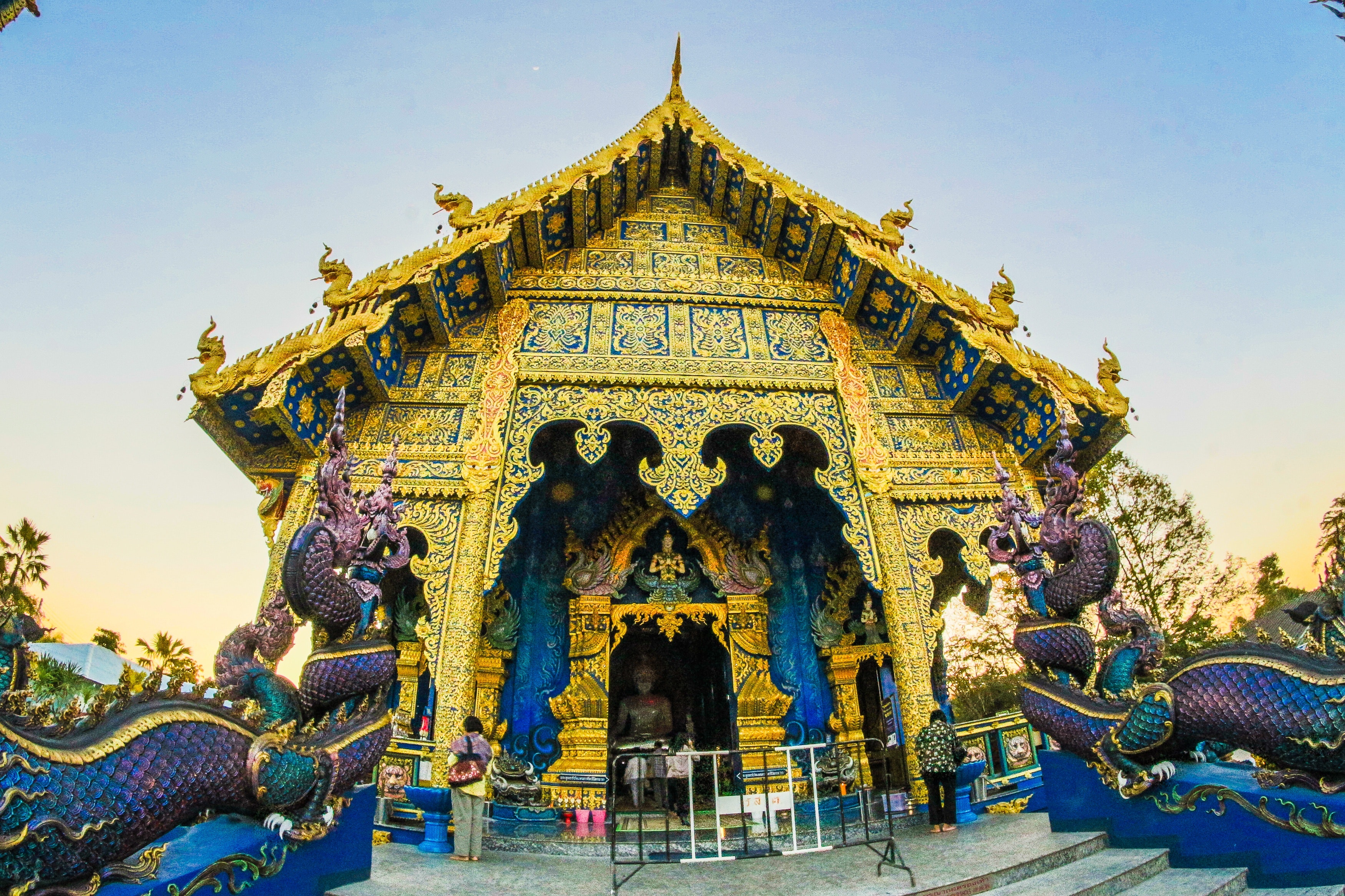 Photo of gold-colored altar with dragon figurines