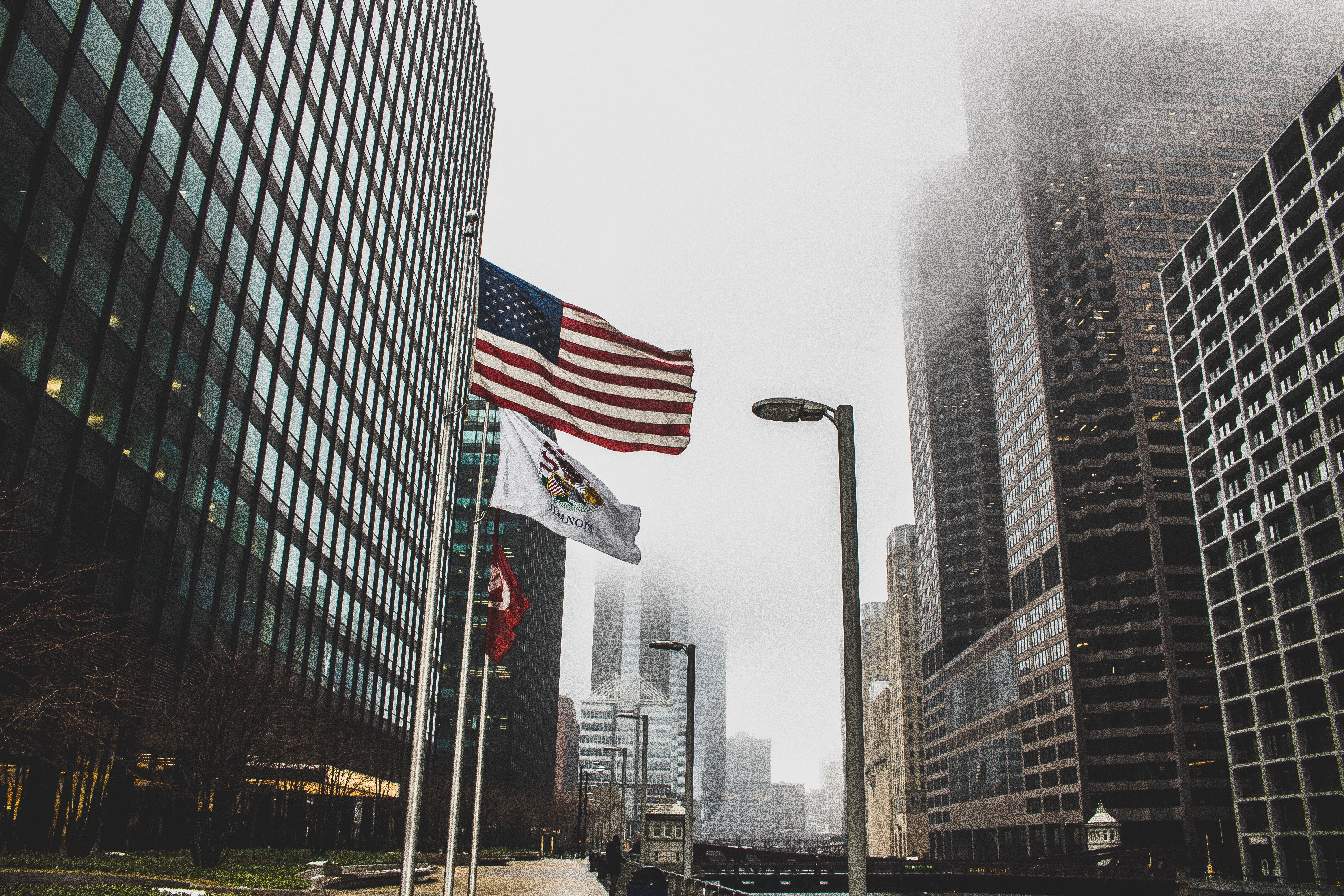Photo of High Rise Buildings on a Foggy Day, American flag, Outdoors, Hazy, Low angle shot, HQ Photo